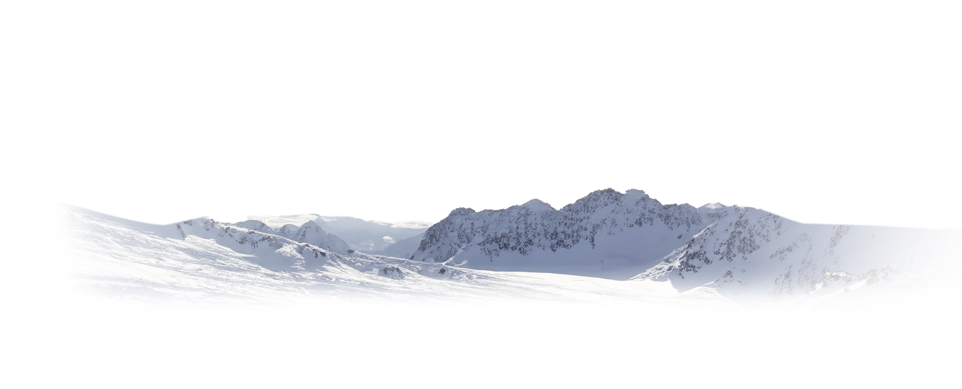 Snow-covered mountain range with rugged peaks under a clear sky.