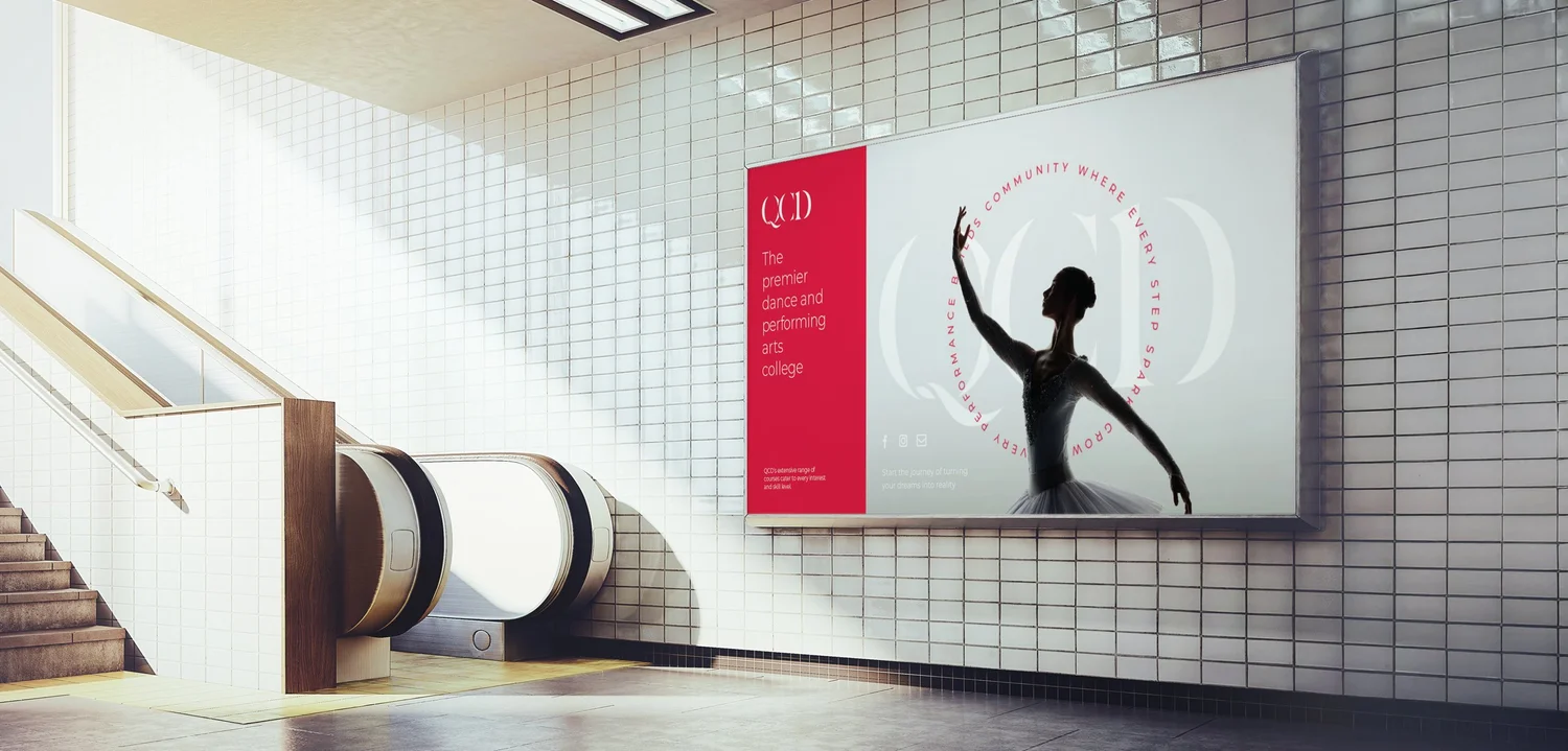 QCD campaign artwork displayed on a billboard