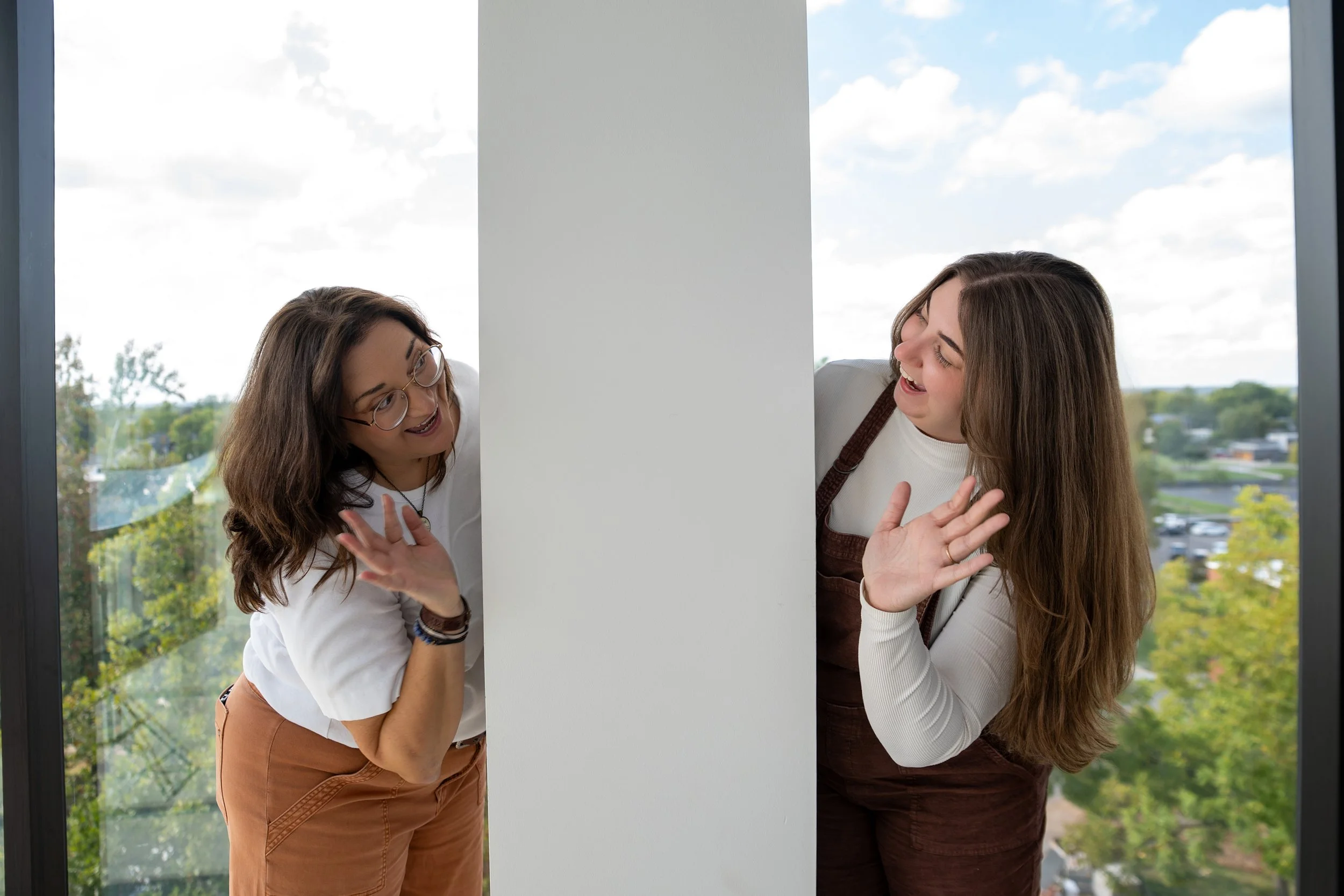Cari Kaufman and Alex Andrews of Storyteller Wordsmith in conversation on opposite sides of a column — because real connection happens when you're talking to someone, not at everyone