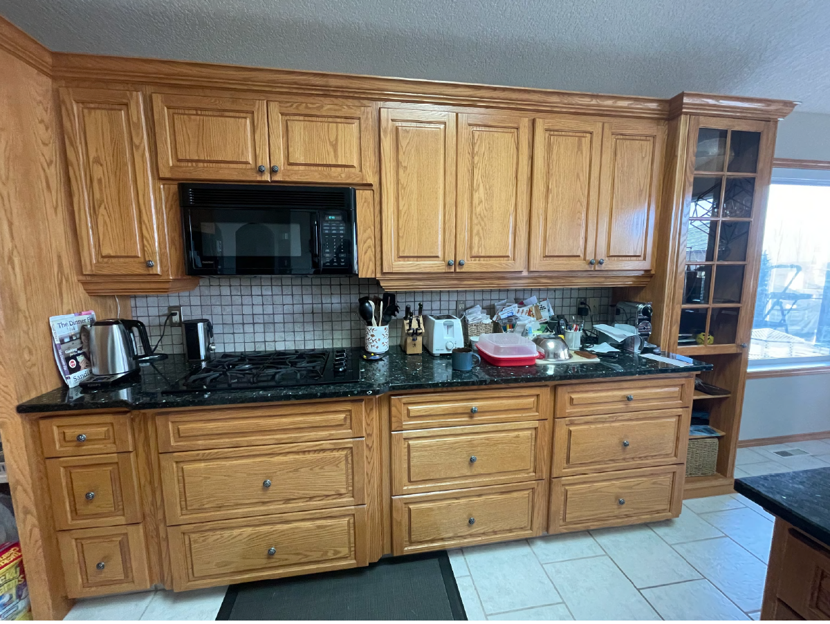 Royal Oak Calgary kitchen before renovation with oak wood cabinets and dark countertops