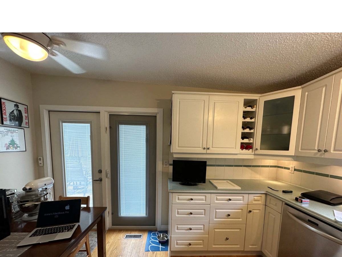 Calgary renovation contractor Dalhousie kitchen before renovation with dated cabinetry and laminate countertops