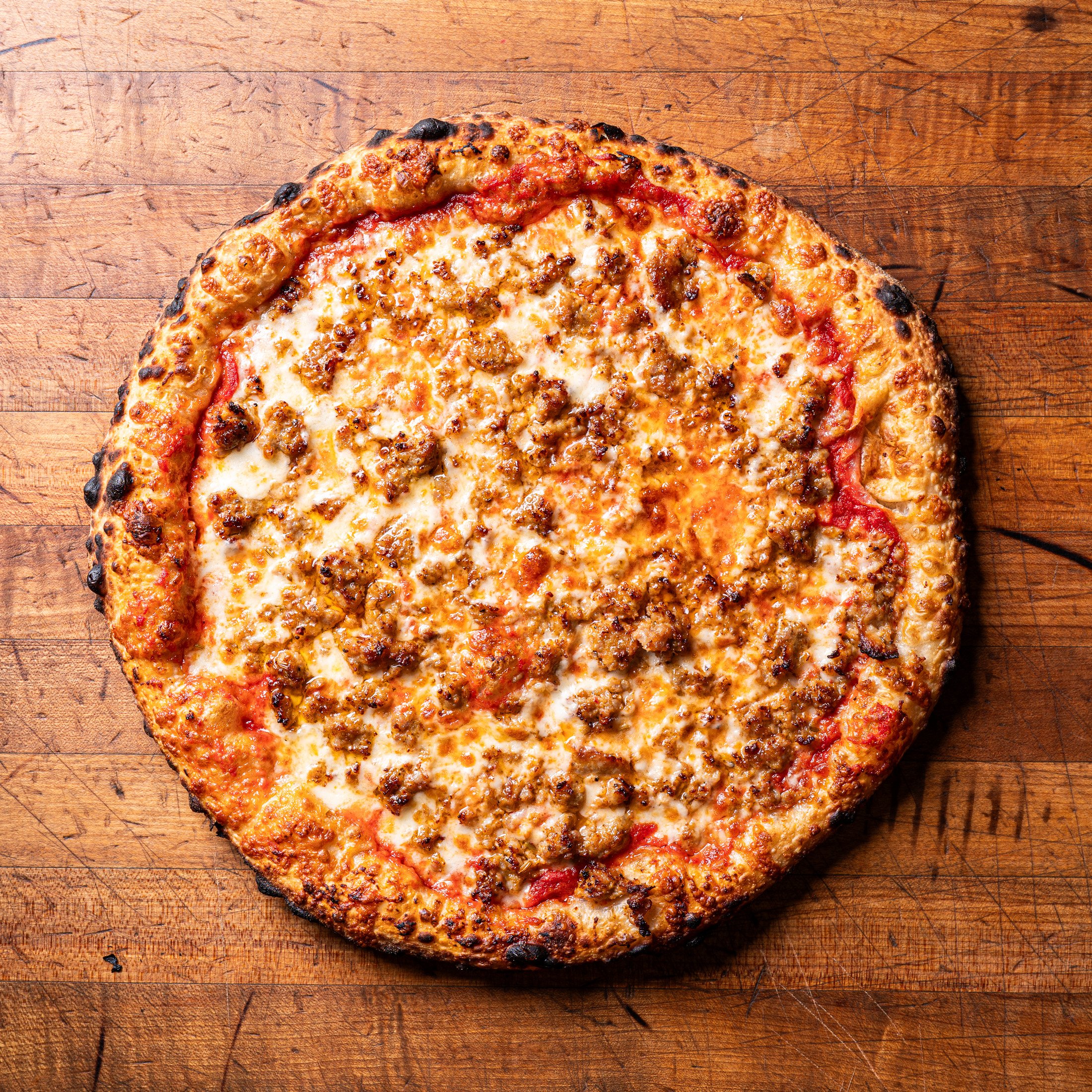 Overhead view of sausage pizza