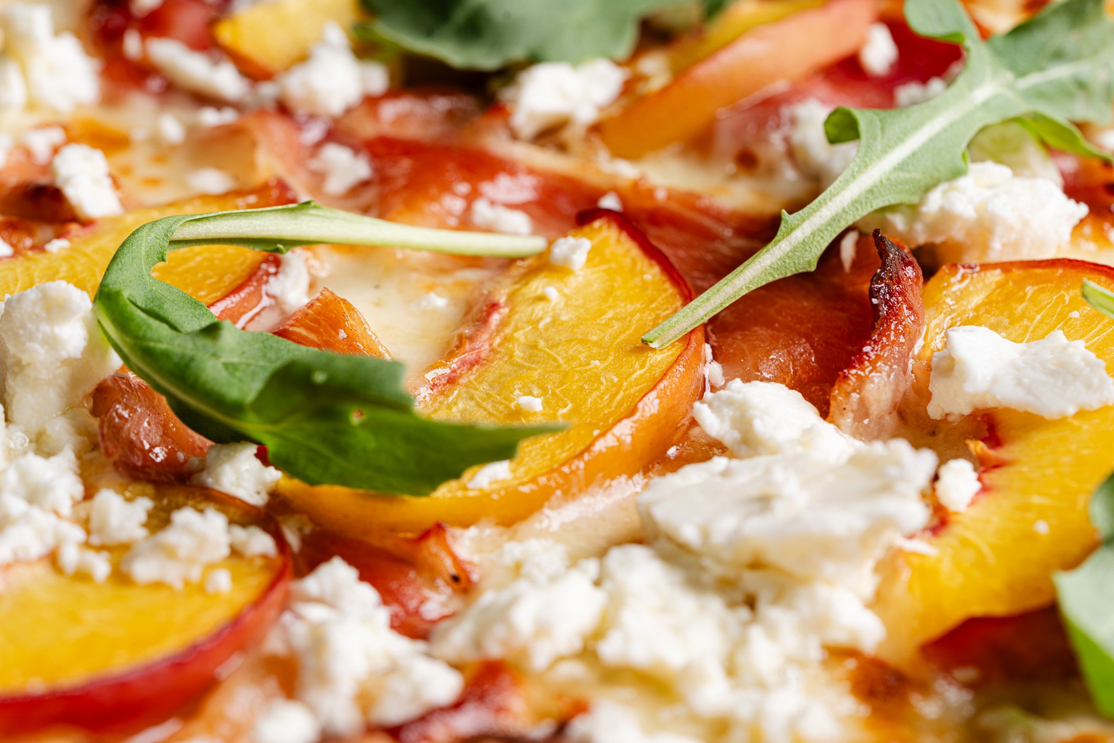 A detailed view of the perfectly baked toppings on the Genevieve special.