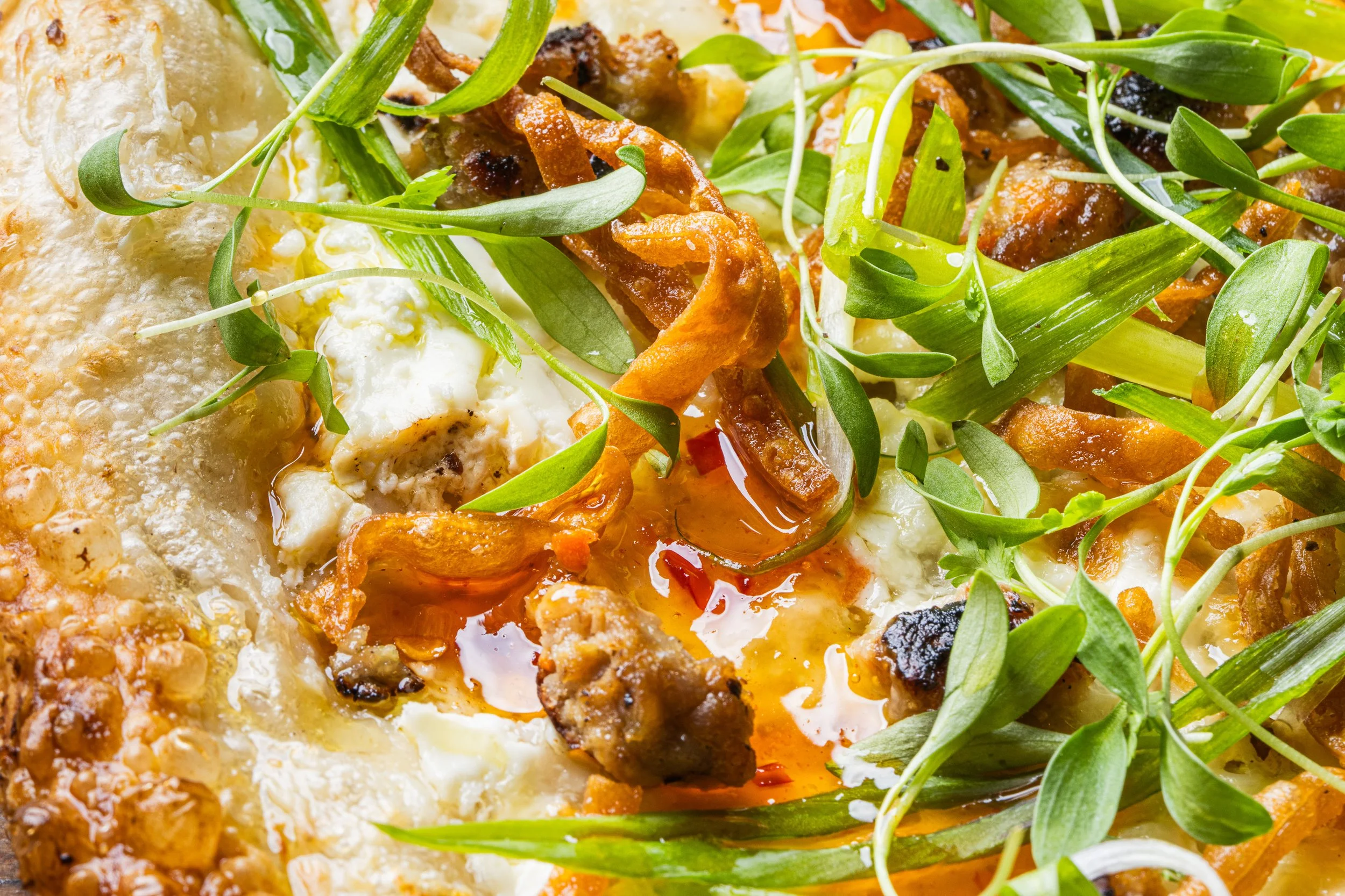 Toppings and sweet chili sauce on the Werkz special.