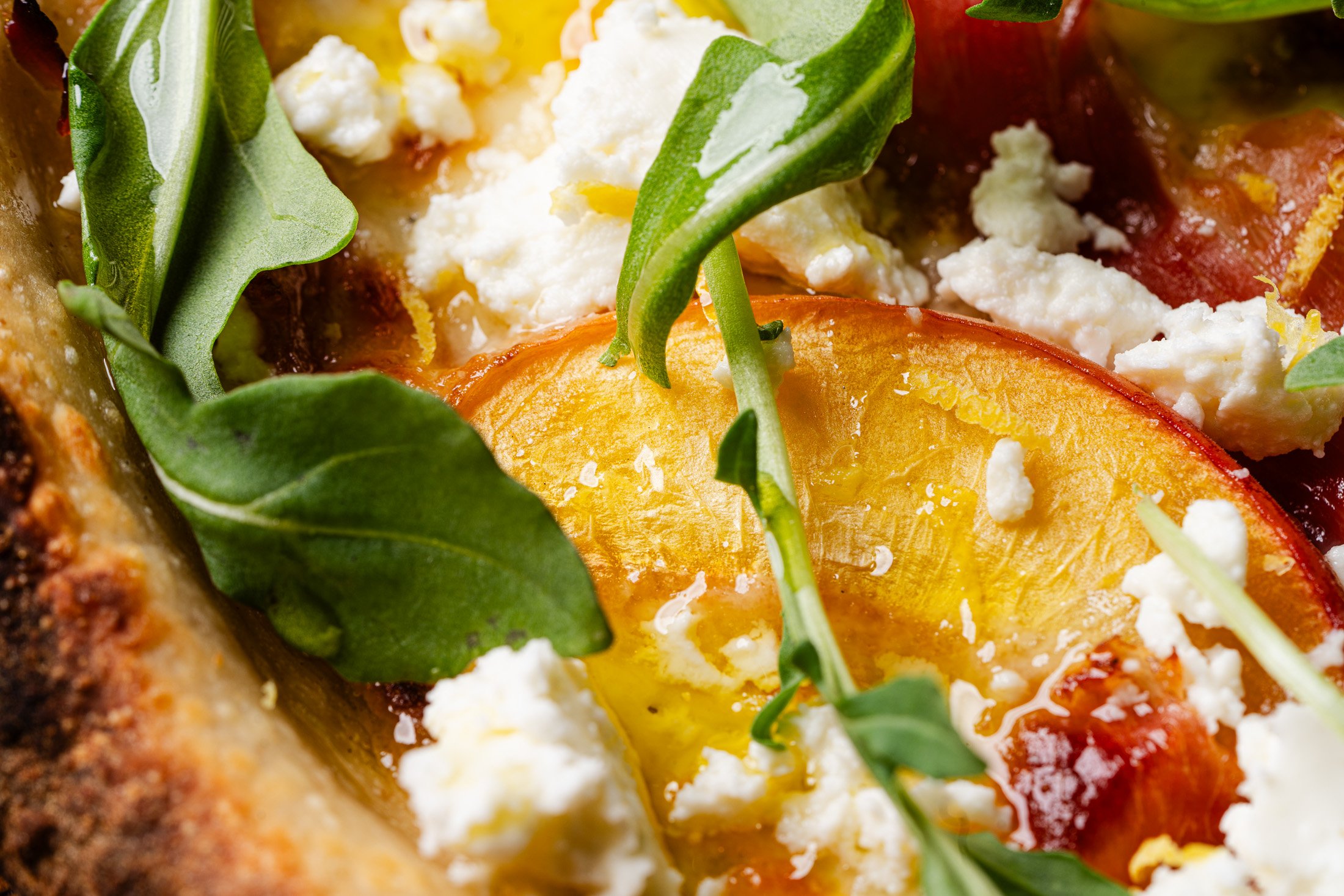 The Genevieve special with peaches, goat cheese, prosciutto and arugula.