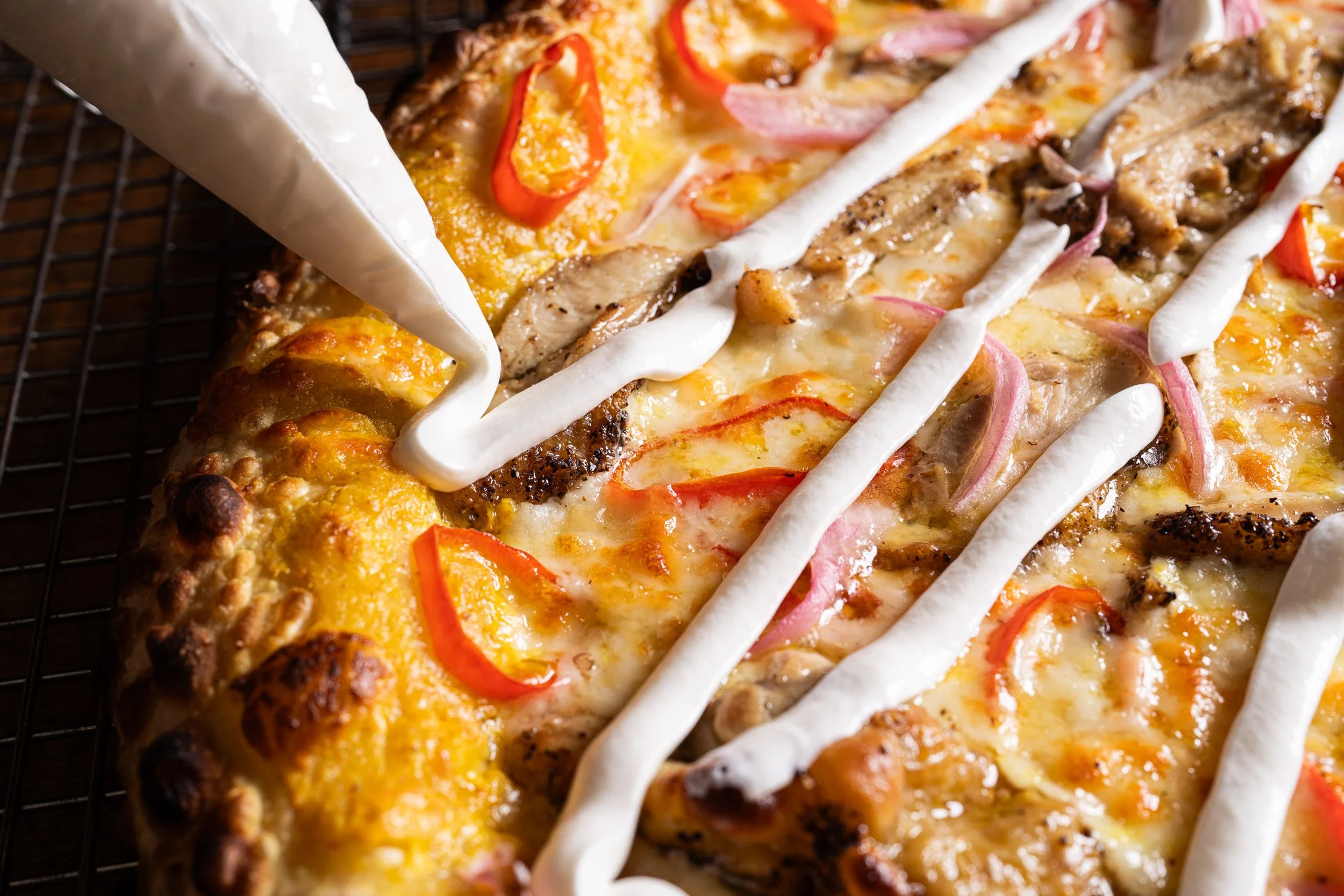 Finishing the Thai Chicken curry pizza