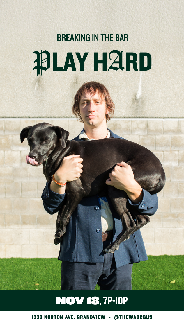 Man holding a black dog in front of a beige wall with event details for 'Breaking in the Bar' on November 18th from 7 PM to 10 PM at 1330 Norton Ave, Grandview, with social media handle @thewagcbus.