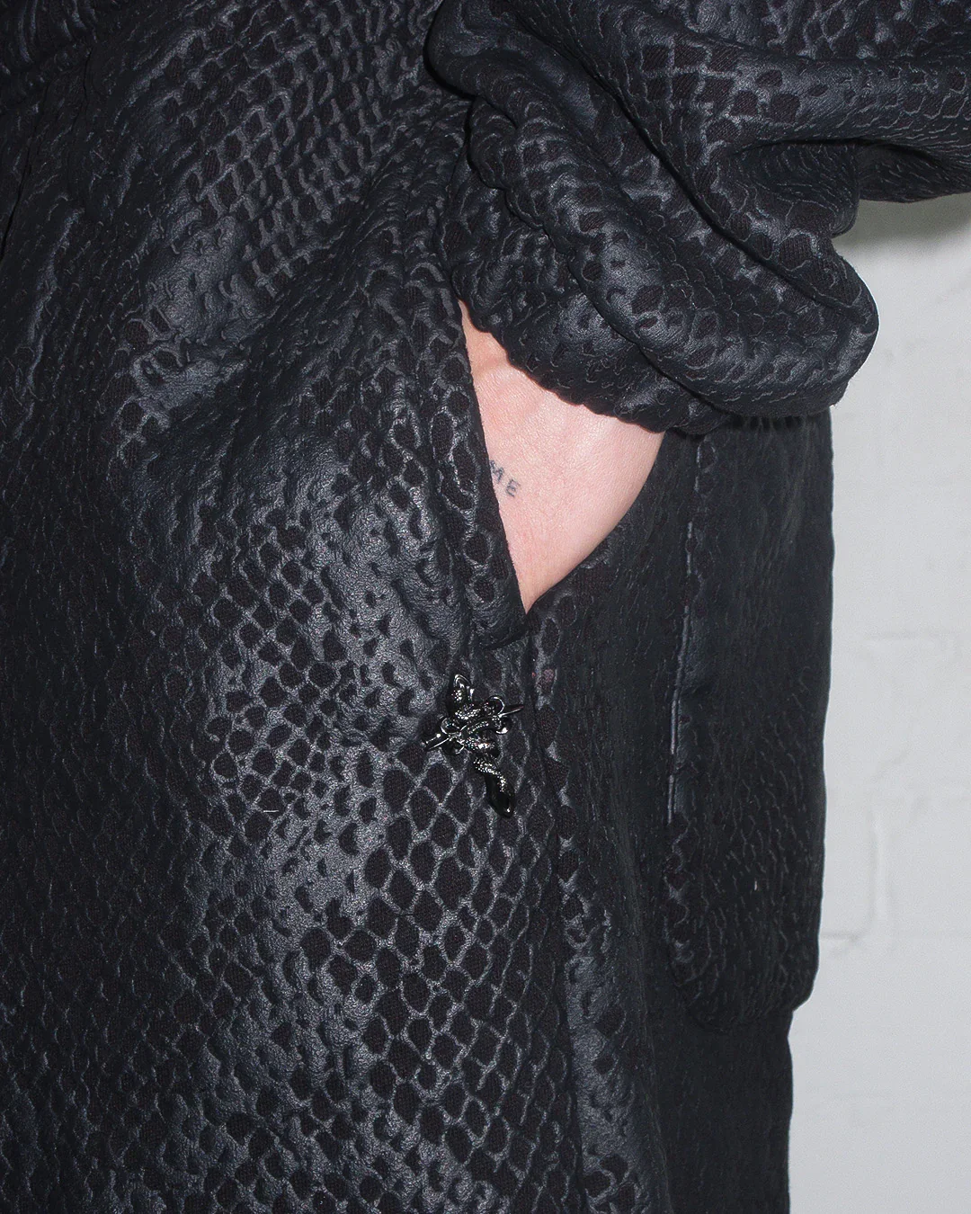 nocturnal-snakeskin-textured-oversized-sweatpants-black-5.webp