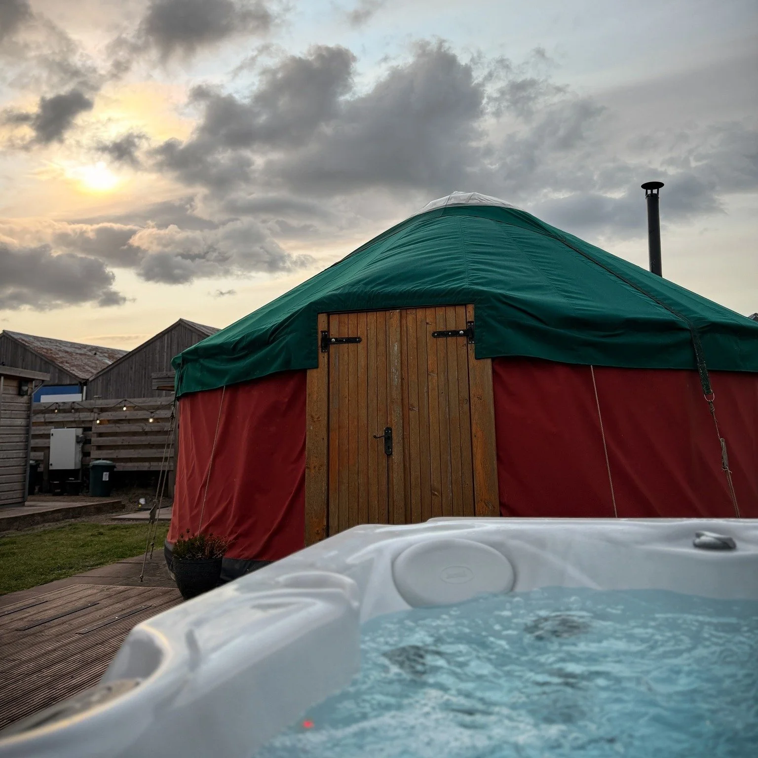 Winter at Bachilton Farm hits differently. Frost on the fields. Steam rising from a the hot tub. 

Your own glamping yurt glowing in the dark like a snug little hideout. Each yurt sleeps up to six, so bring the full crew, the kids, or the dog. Pets a