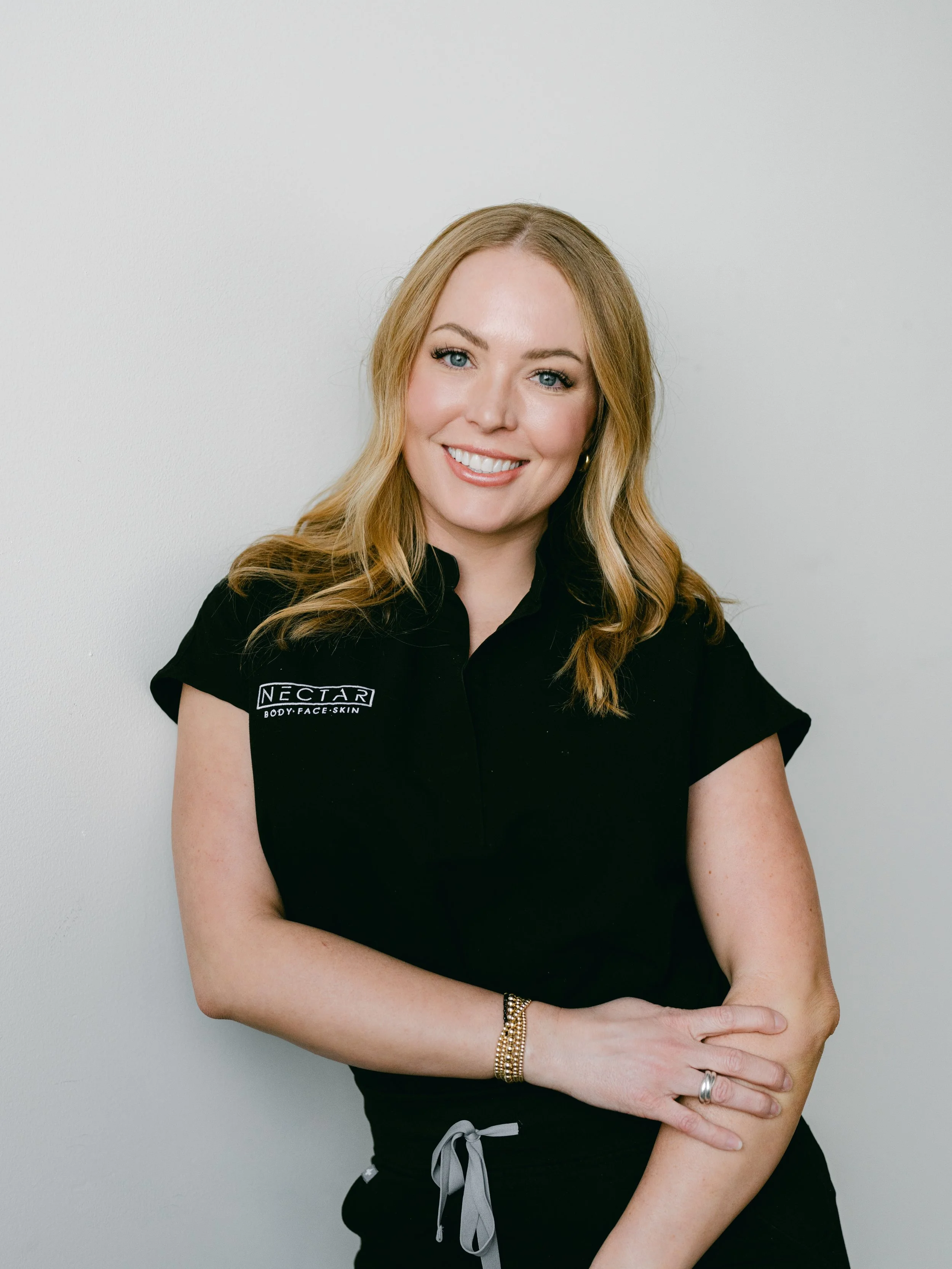 Jess Farhat Head Shot in Black Scrubs