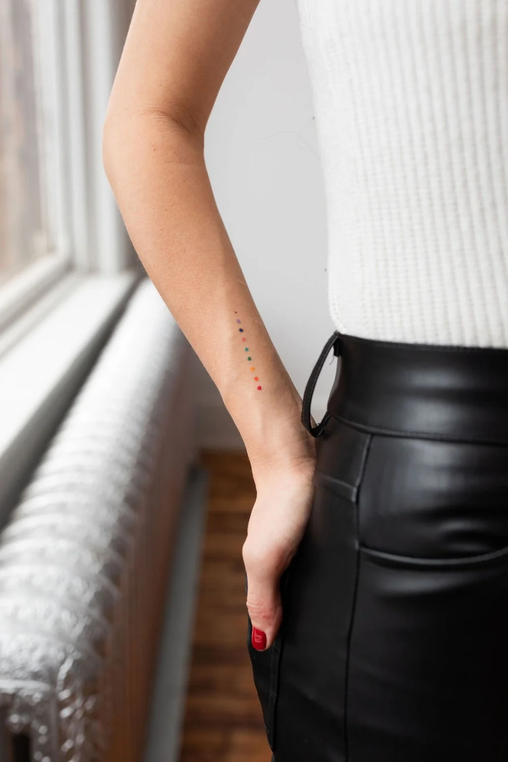 LGBTQ somatic coaching rainbow tattoo