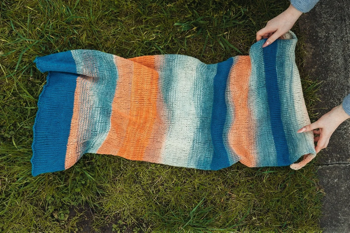 Wool is a sustainable and biodegradable material that is circular by nature. It is taken from the sheep, used within textiles, then can be put back into the environment due to its ability to be composted. The nutrients from the wool get absorbed back