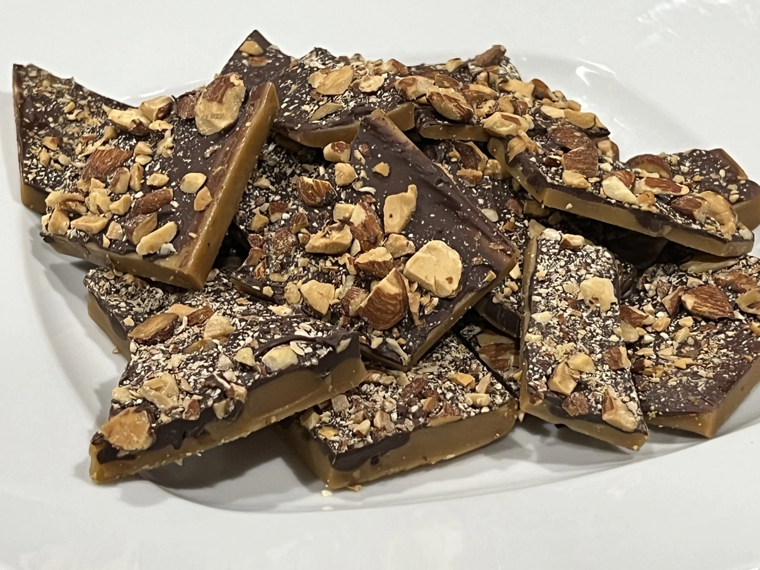 toffee with chocolate and almonds on top