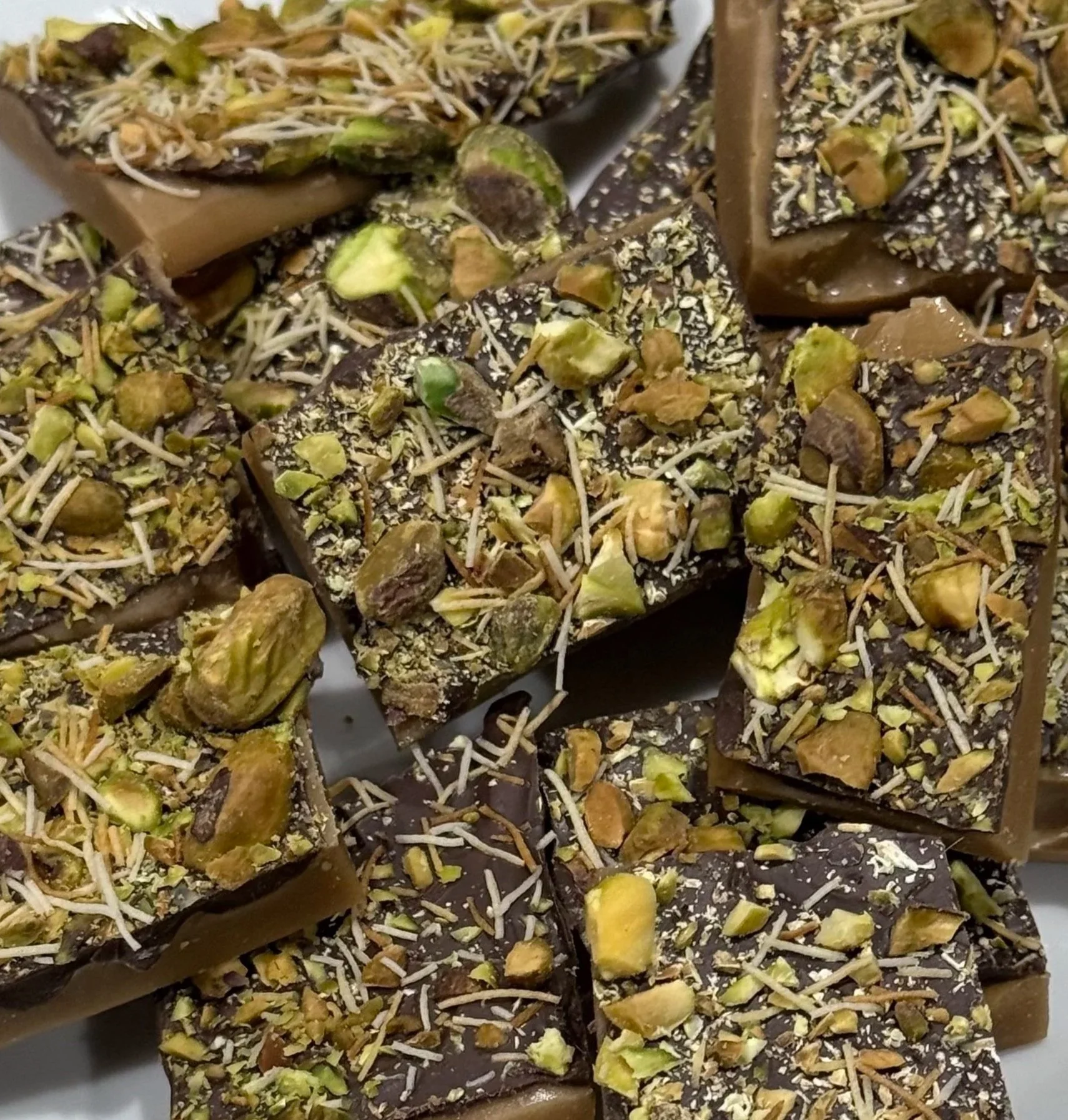 toffee covered in pistachios and toasted kataifi pastry