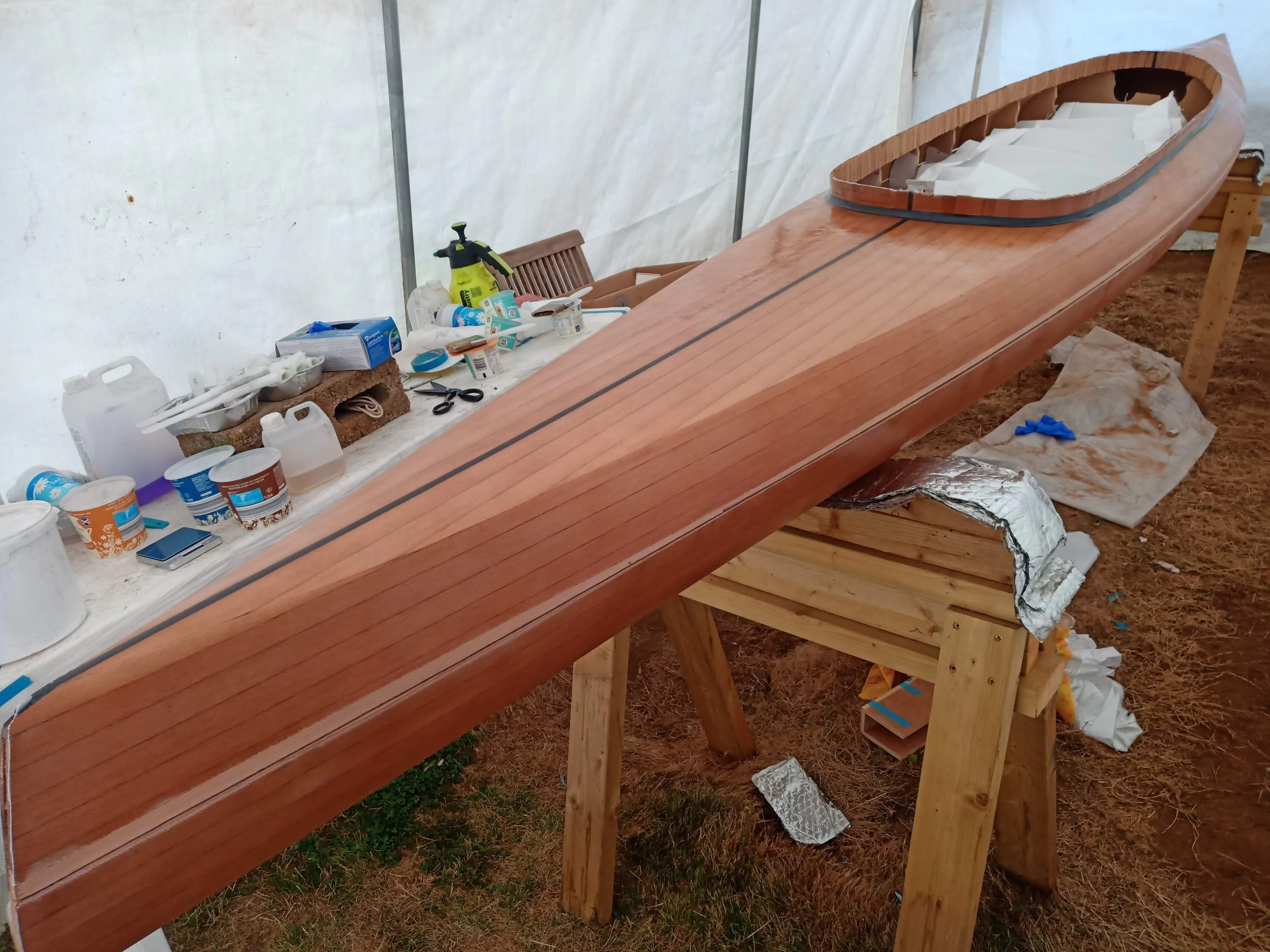 The epoxy resin really brings out the grain. Notice how there is an un-laminated strip along the deck-hull parting line.