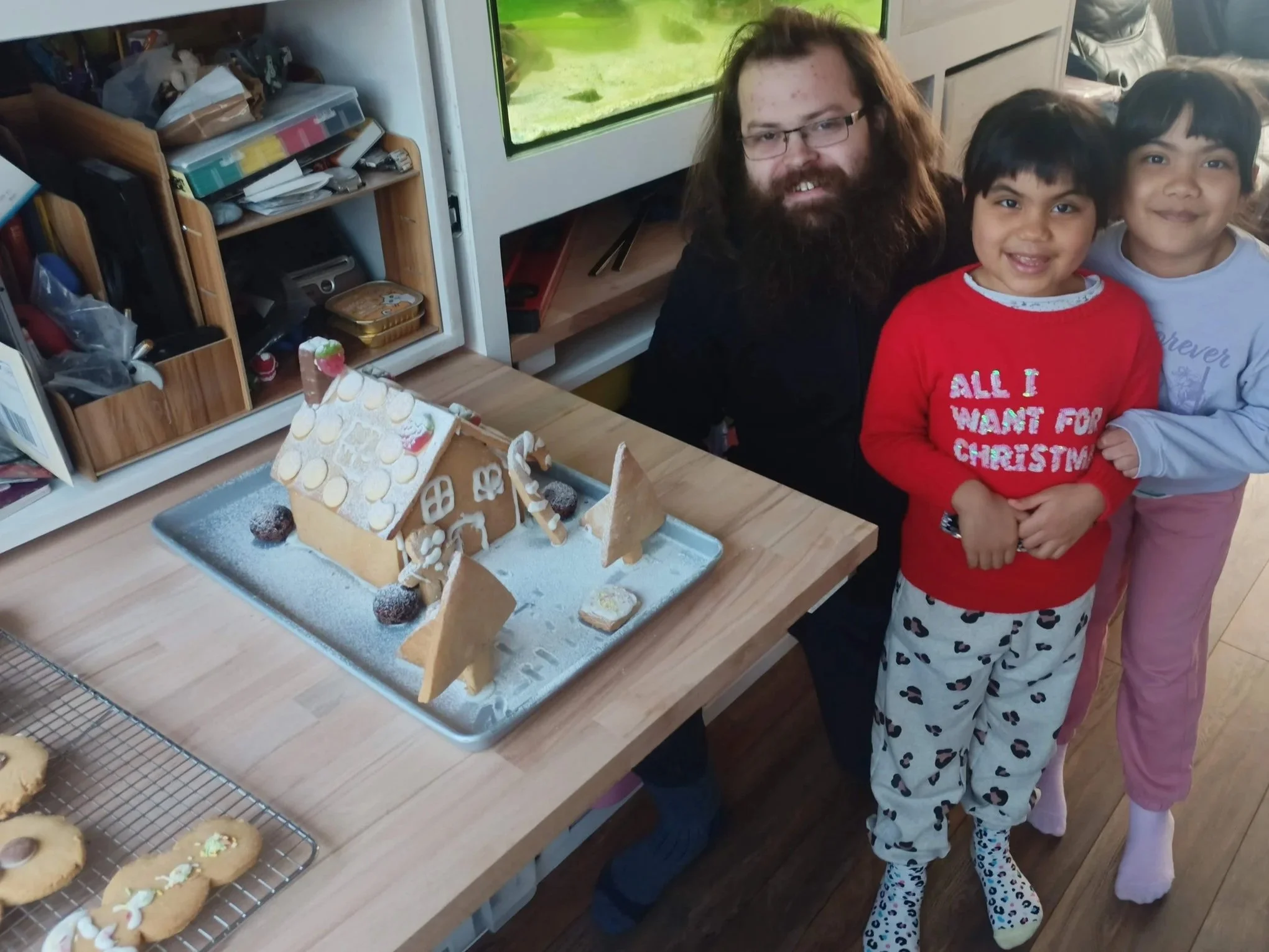 I helped the girls measure out ingredients, mix the dough, cut and bake the shapes, before assembling the house and decorating with icing and sweets.