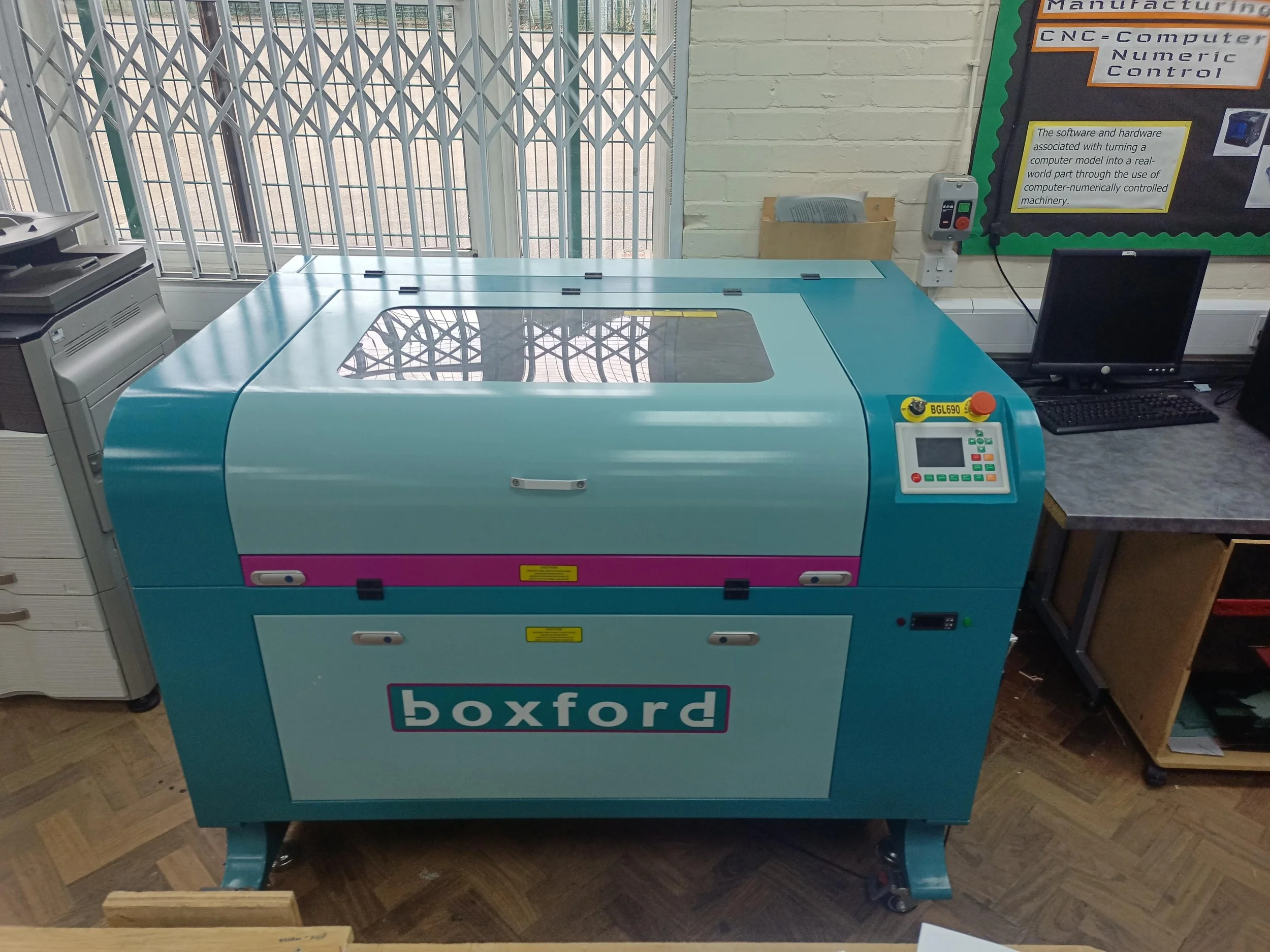 The laser cutter itself. Capable of cutting a range of organic materials to a depth of up to 9mm or more and engraving in even more materials including stone and glass.