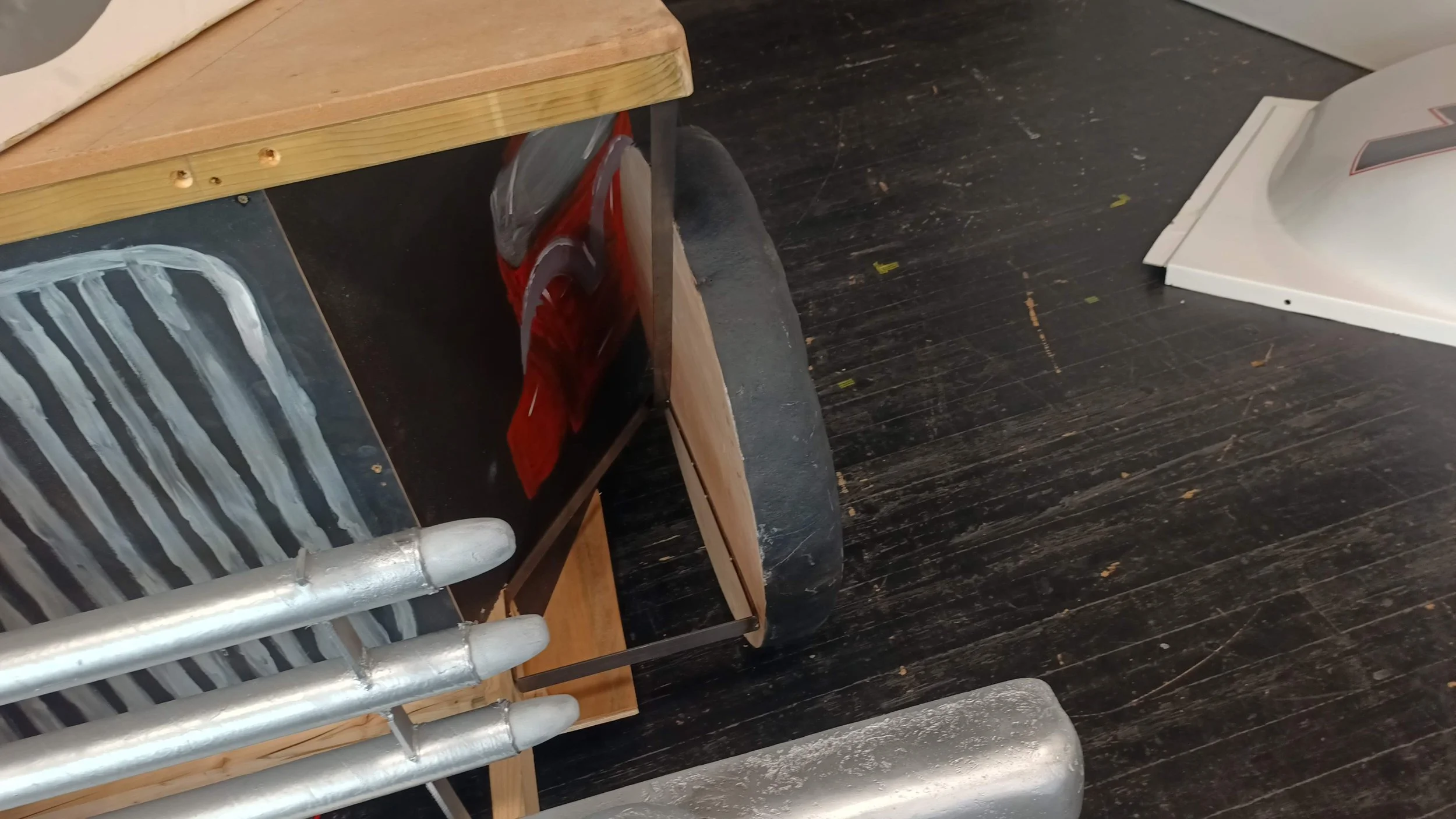 The wheels were made from plywood, with grp coated foam tires and 6mm MDF wheel centres. The wheels were hung from a set of brackets that I fabricated to attach them to the main frame. They sat about 15-20mm above the stage floor.