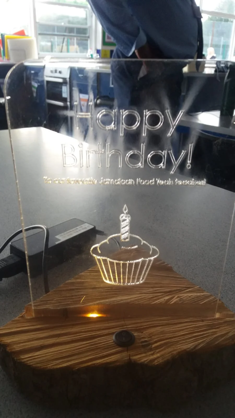 A laser engraved acrylic birthday card/gift, edge-lit from below provided a unique celebration for a colleague.