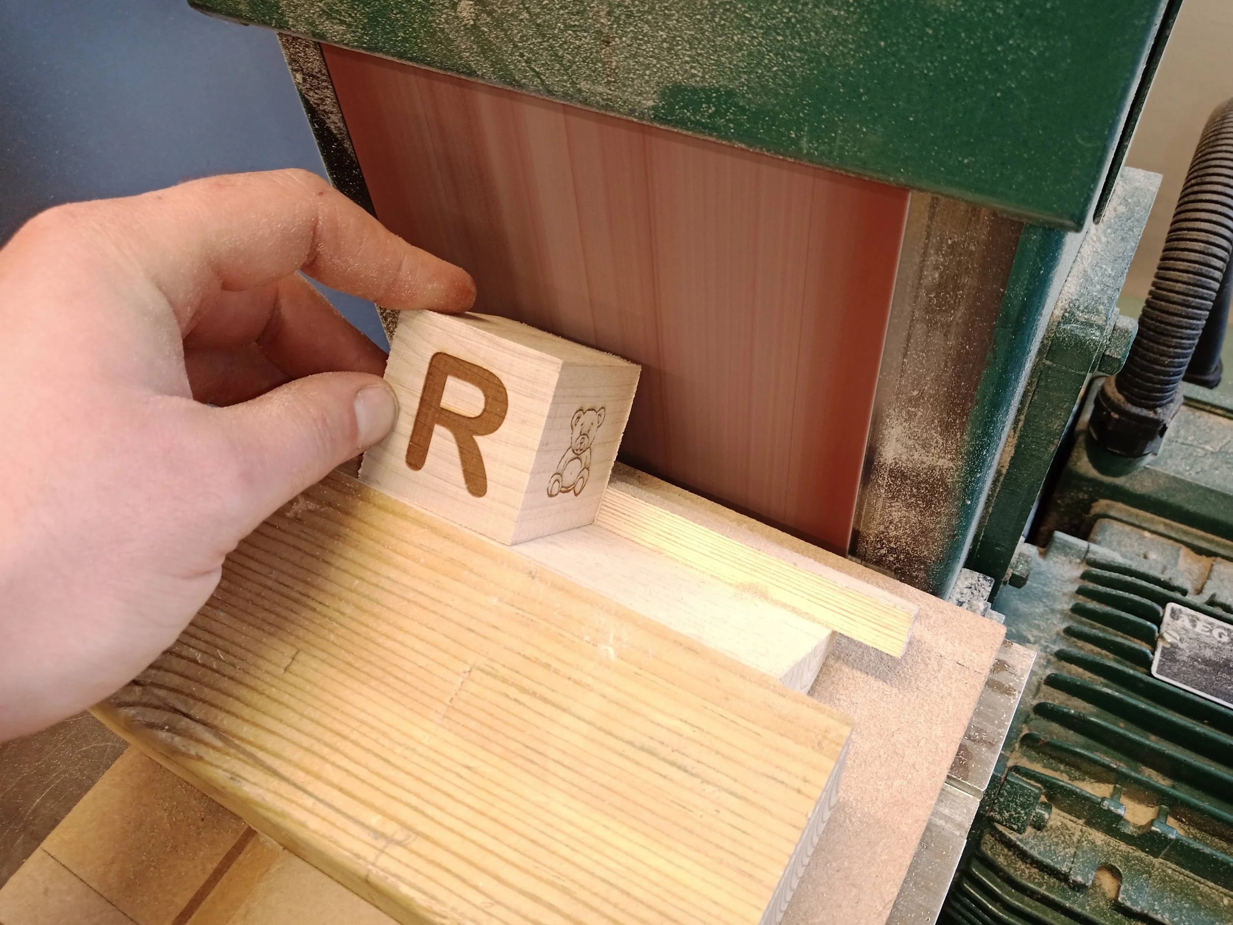 I made a sanding jig to get consistent chamfers on each corner and had previously used a jig to ensure proper alignment for laser engraving.
