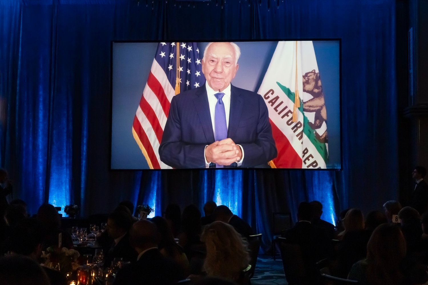  Angelo K. Tsakopoulos accepts his Lifetime Achievement Award via video during the 50th Anniversary Hellenic Heritage and National Public Service Awards Gala. 