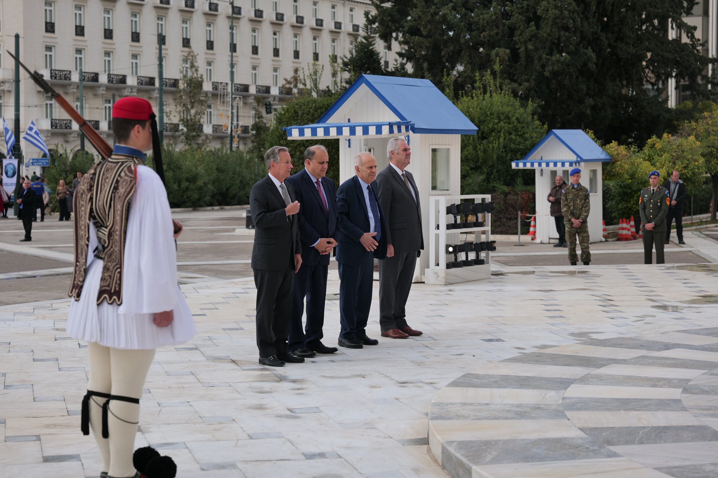  President Larigakis and AHI delegation leadership at the Tomb of the Unknown Solider next to an Evzone.   
