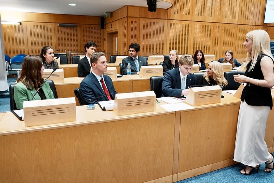 President of the House of Representatives, Annita Demetriou (right) briefing the students.