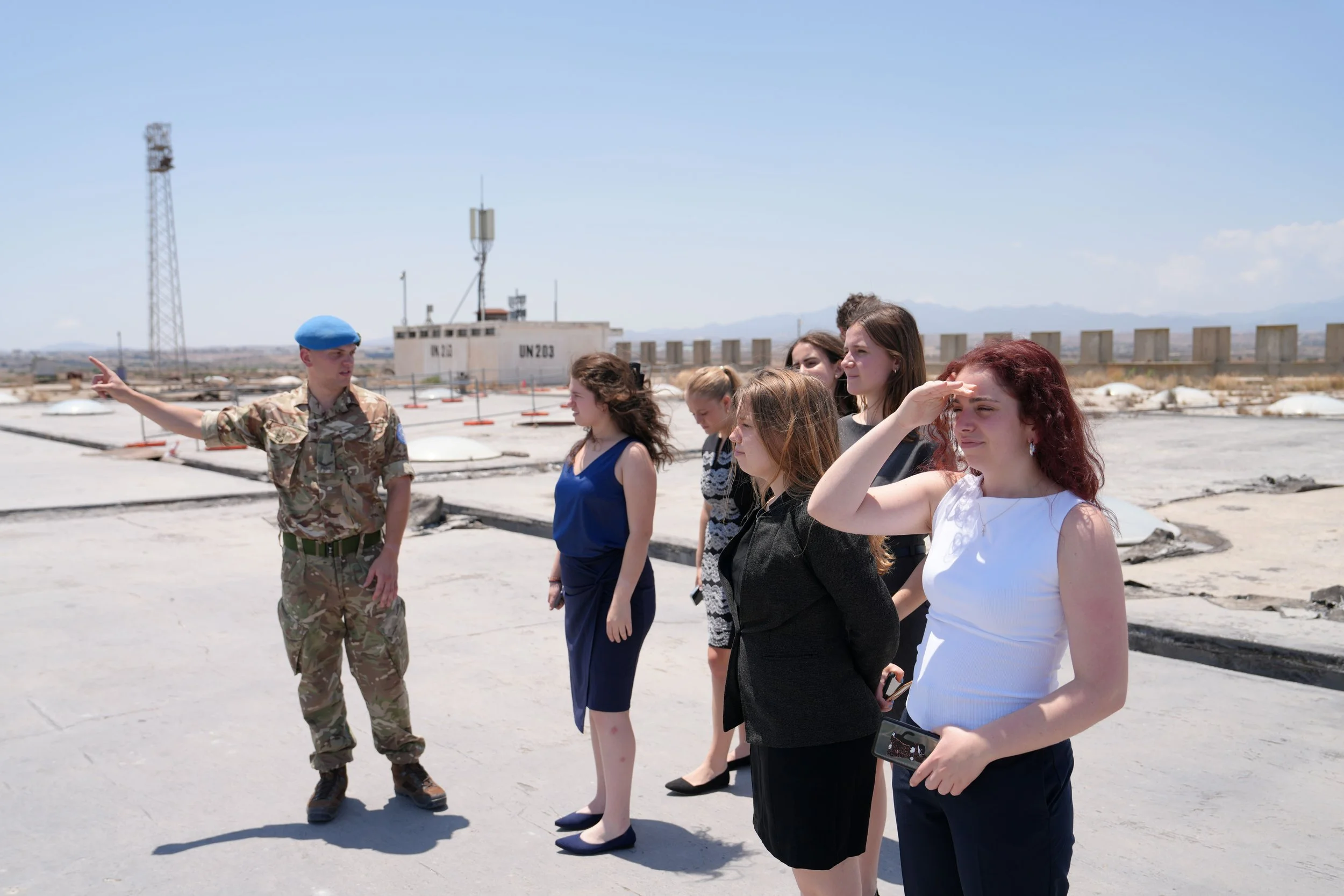 A UN representative guides the student delegation on a tour on the roof of the abandoned hall of the Nicosia International Airport