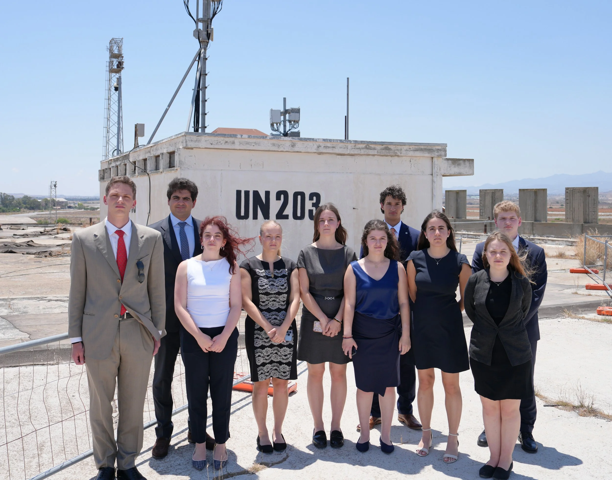  Students on the roof in front of UN signage.  