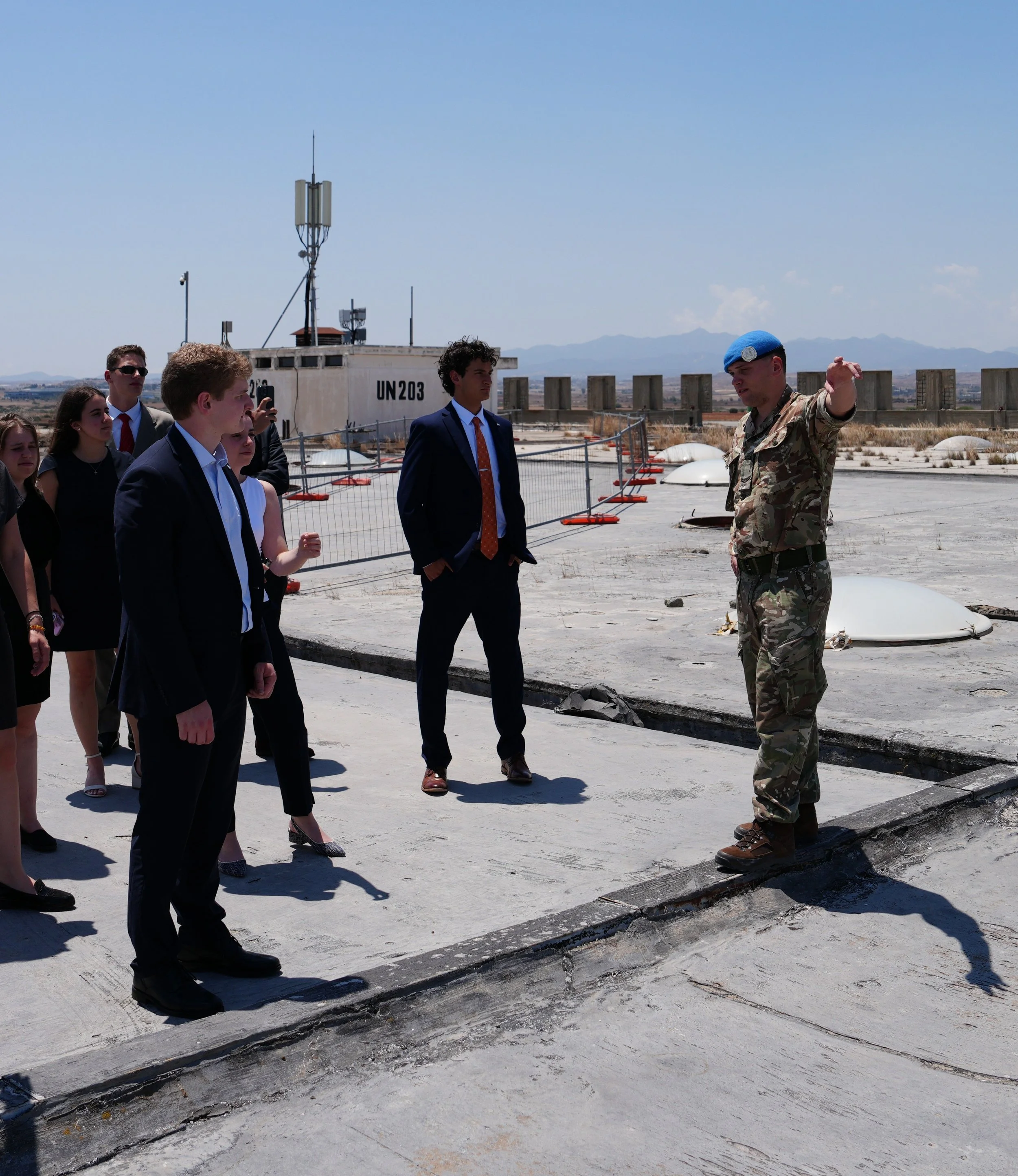  A UN representative guides the student delegation on the roof of the abandoned hall of the Nicosia International Airport 