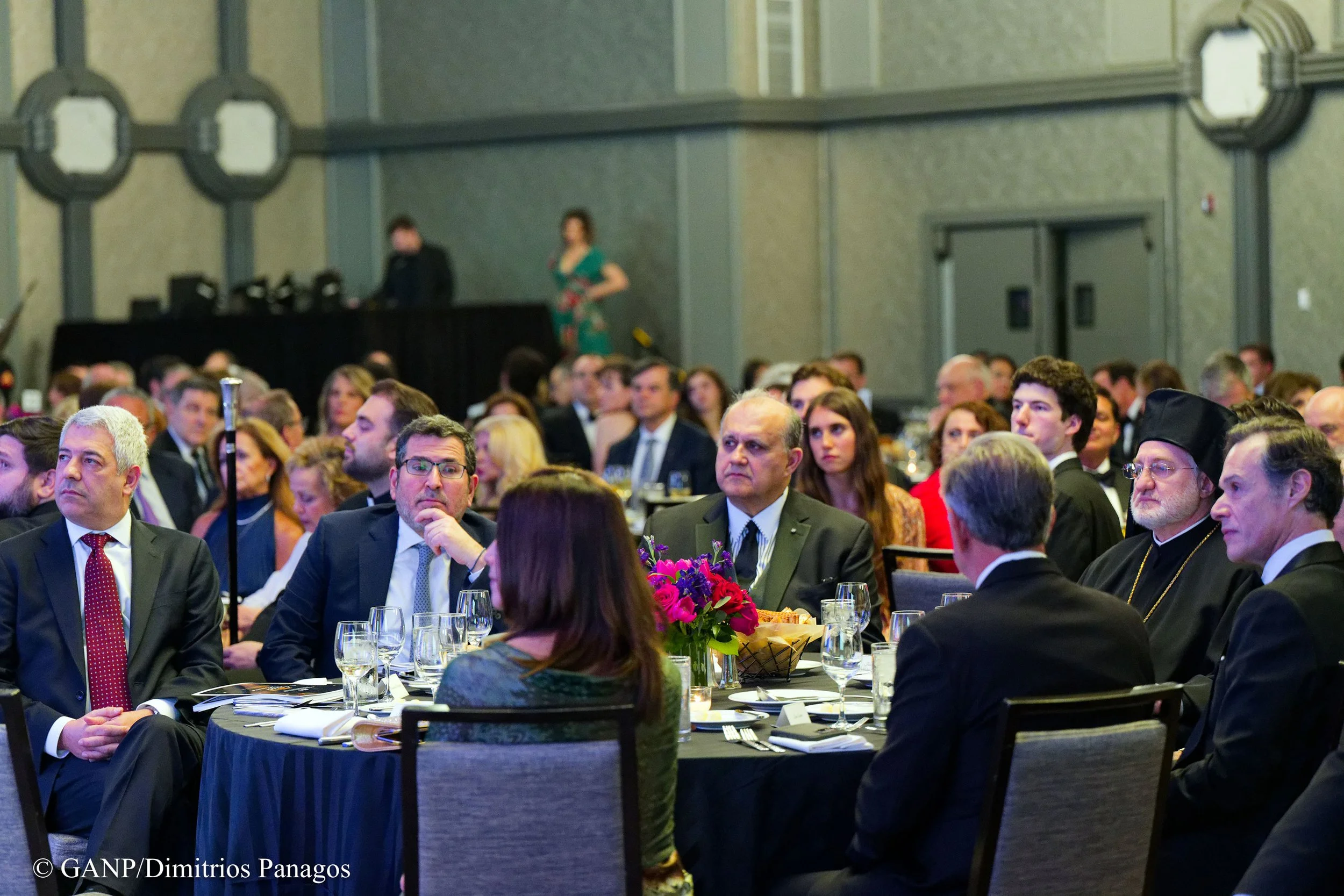 Main table (visible, L–R): Alexandros Paterakis (PPC Greece); Amb. Evangelos Savvas (Cyprus); AHI Pres. Nick Larigakis; Archbishop Elpidophoros; Amb. Antonis Alexandridis (Greece)