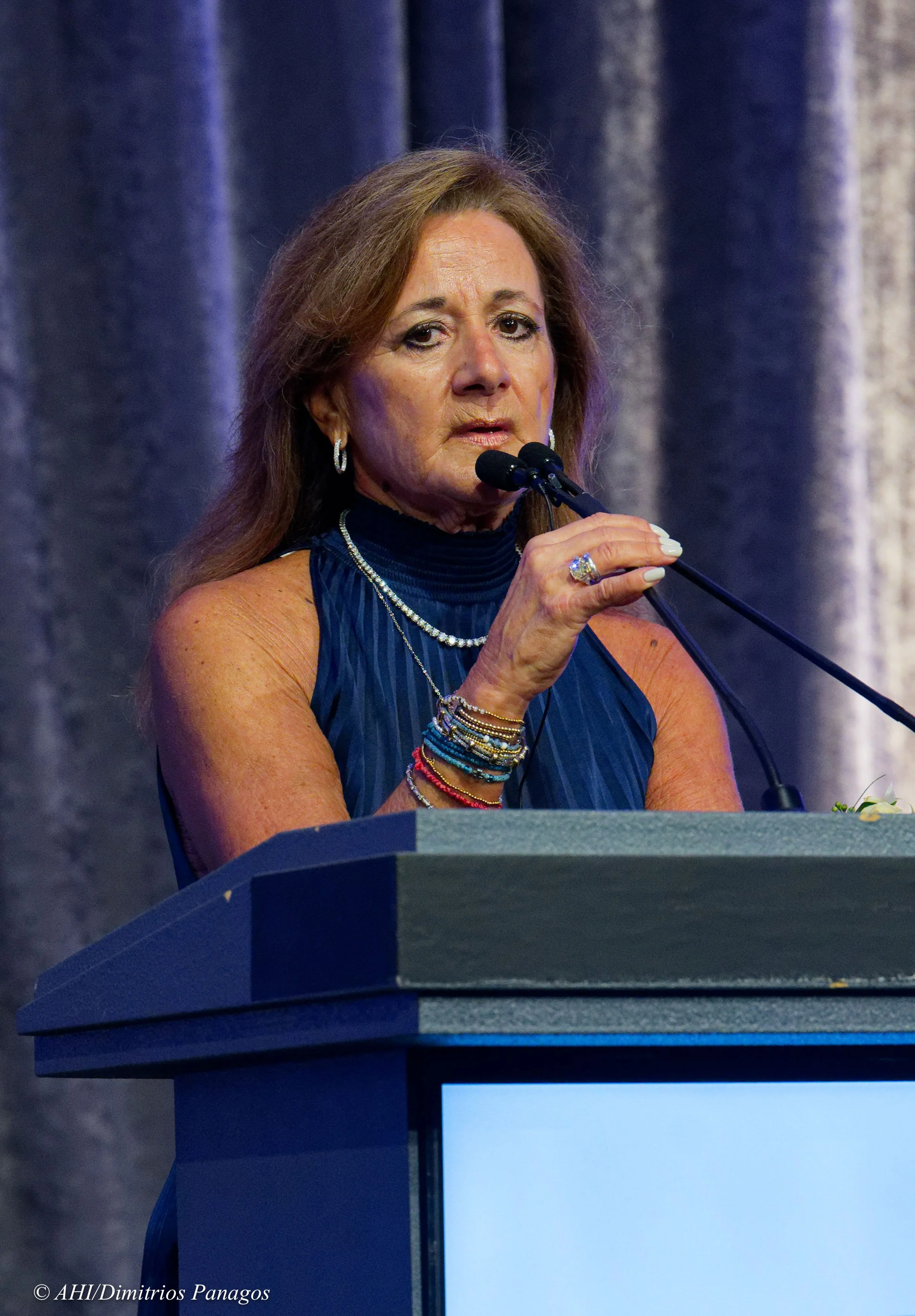 Helen A. Carlos offers remarks following the acceptance of her award