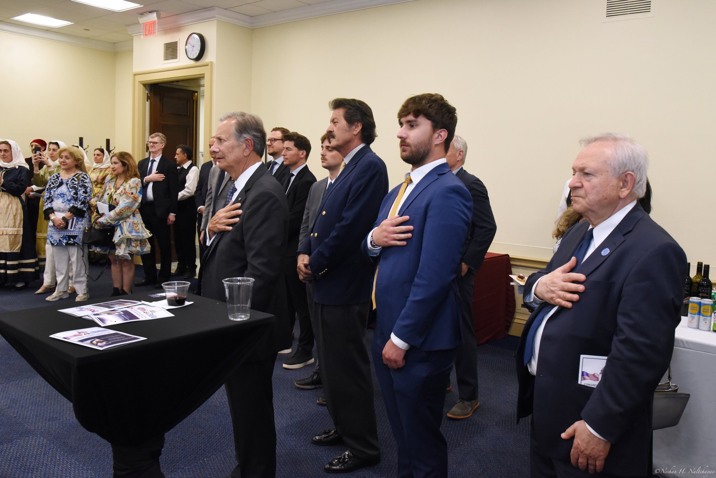 During the singing of the Greek and United States national anthems  