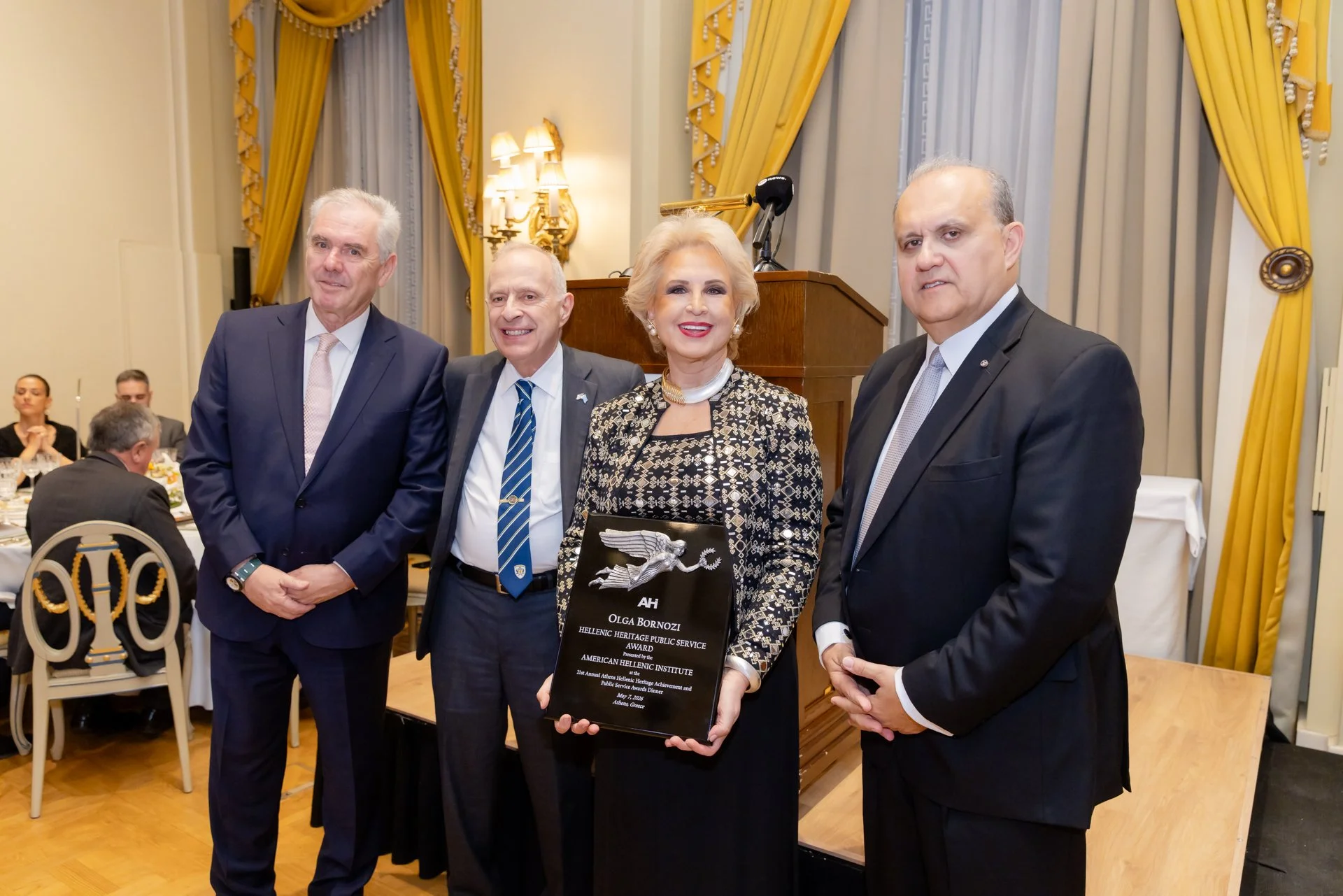 From left to right: AHI-Athens Chapter President Retired Vice Admiral Vasileios Kyriazi; AHI Chairman James H. Lagos, Esq.; AHI Athens Dinner honoree Olga Bornozi; and AHI President Nick Larigakis
