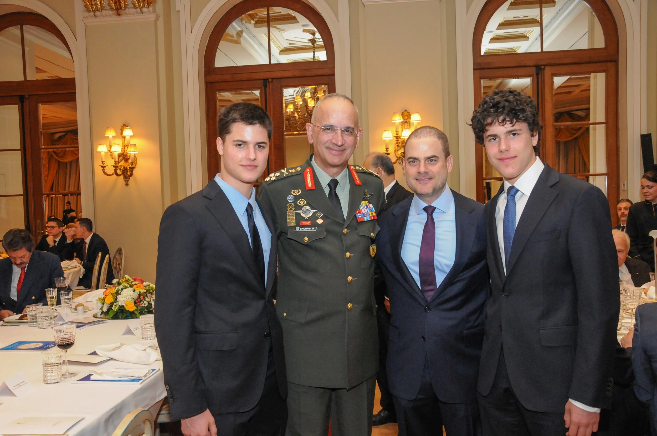 AHI Athens Dinner honoree Mr. Saracakis and his two sons with General Choupis