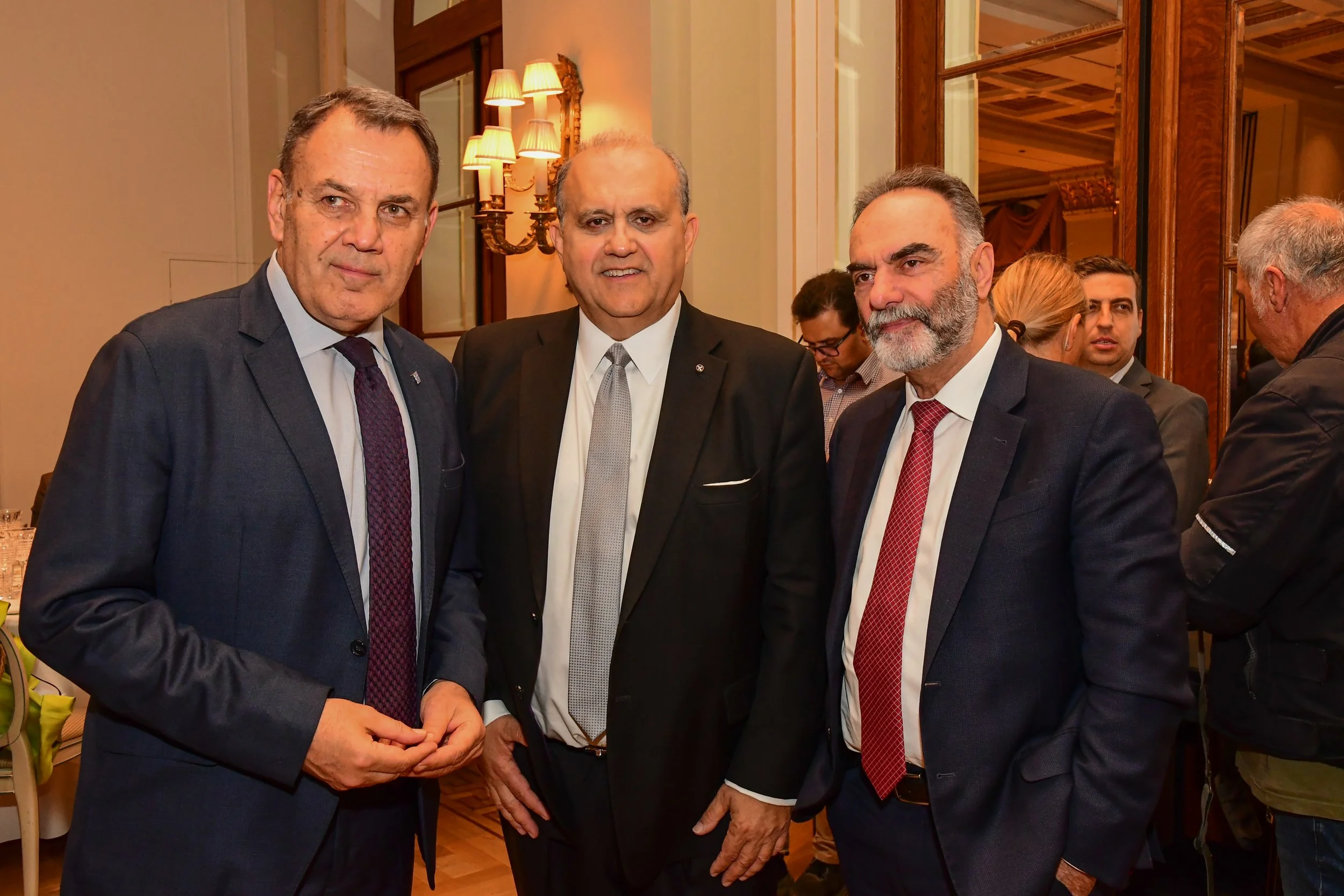 AHI President Nick Larigakis (center) with AHI benefactor Dimitris Dafnis, Managing Director of Aeroservices (right), and former Minister of National Defence of Greece Nikolaos Panagiotopoulos