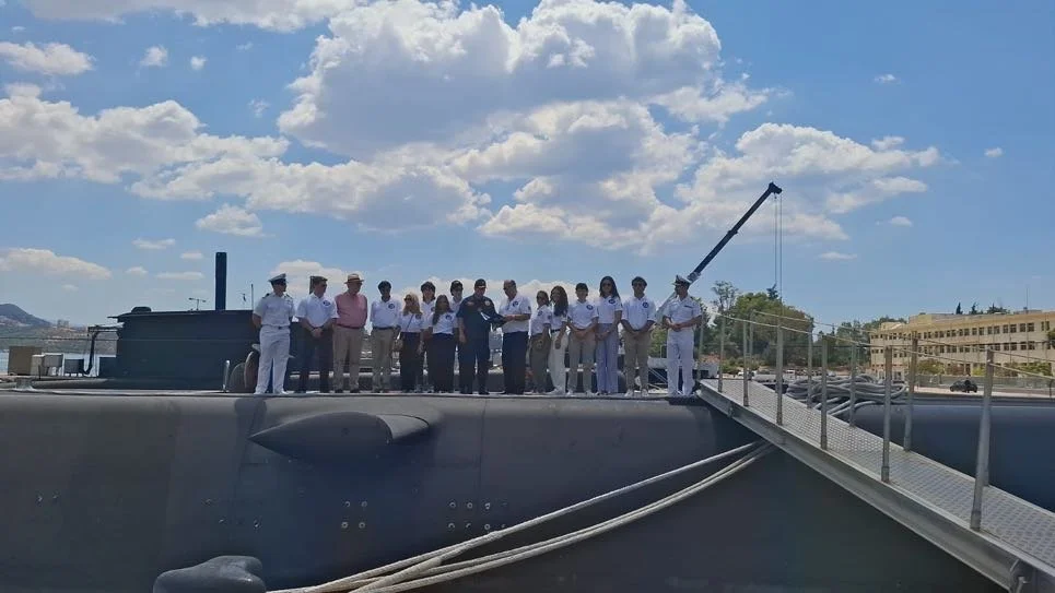 The group poses for a photo aboard the submarine HS Pipinos. 
