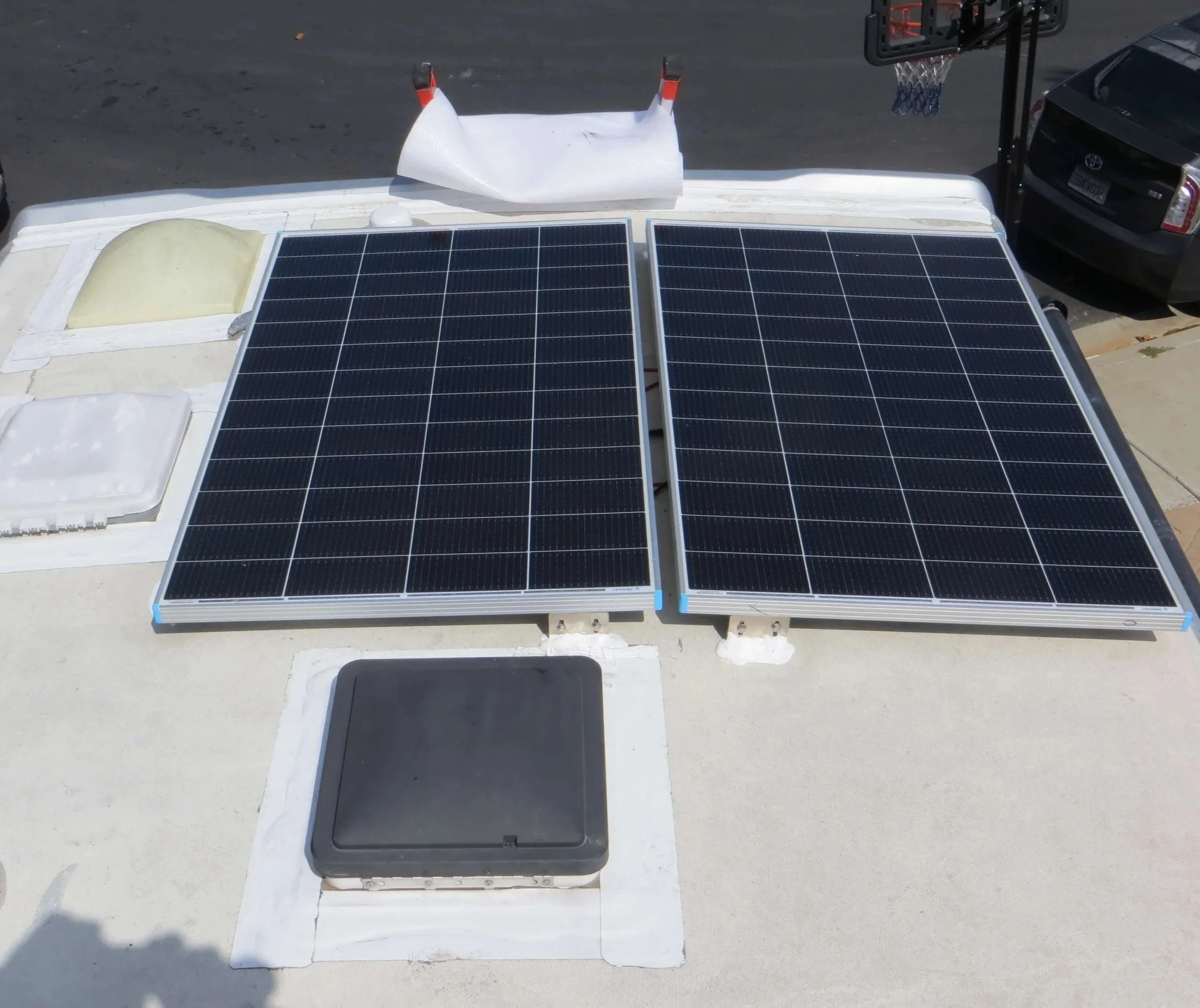 Two solar panels installed on a rooftop, Example of RV Solar Install near San Diego.  Lithium Battery, DC/DC Converter, LiFePO4, Inverter, install on RV near San Diego, CA.