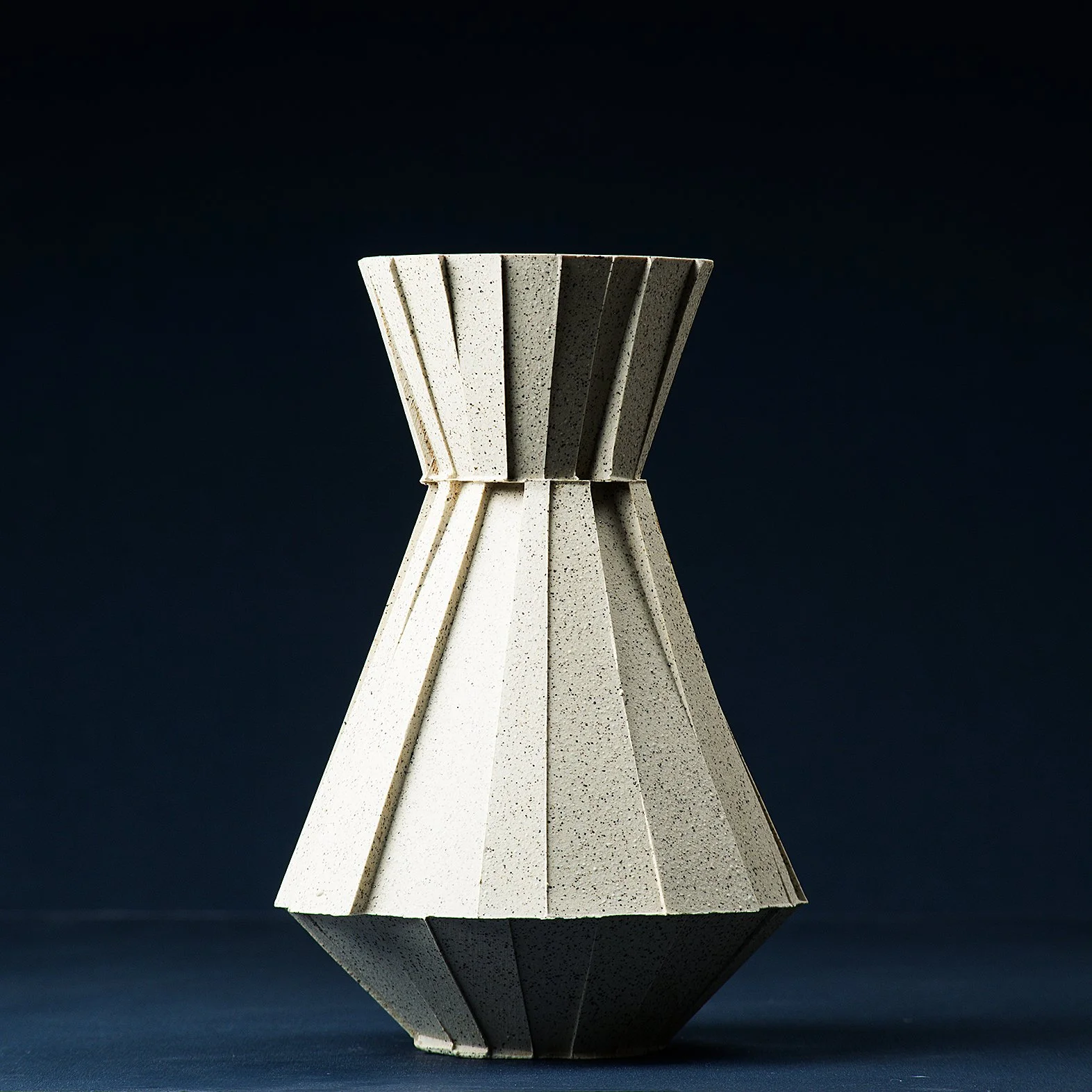 Handmade brutalist faceted ceramic carafe in speckled stoneware, by Lea & Nicolas