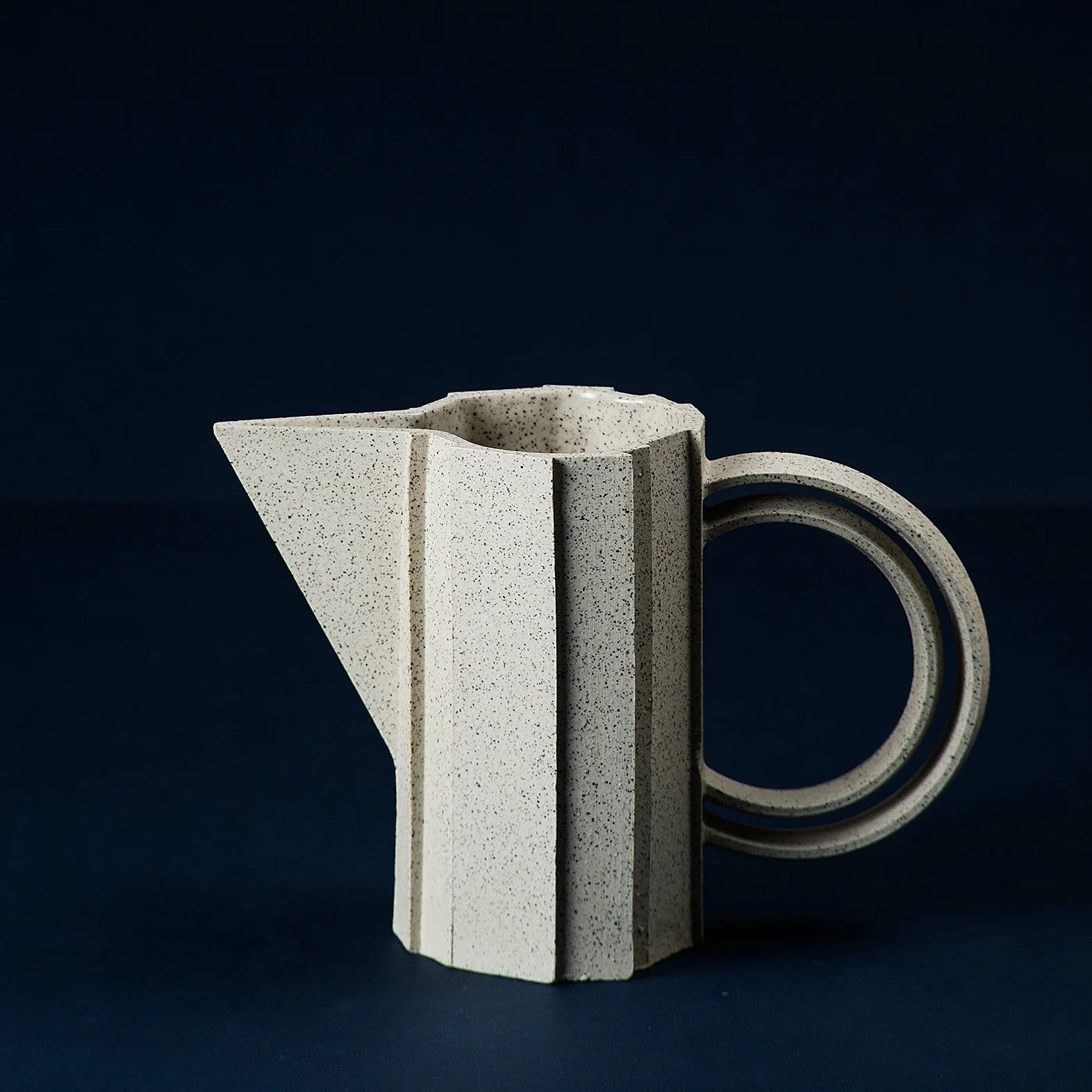 Handmade brutalist faceted ceramic pitcher in speckled stoneware, by Lea & Nicolas