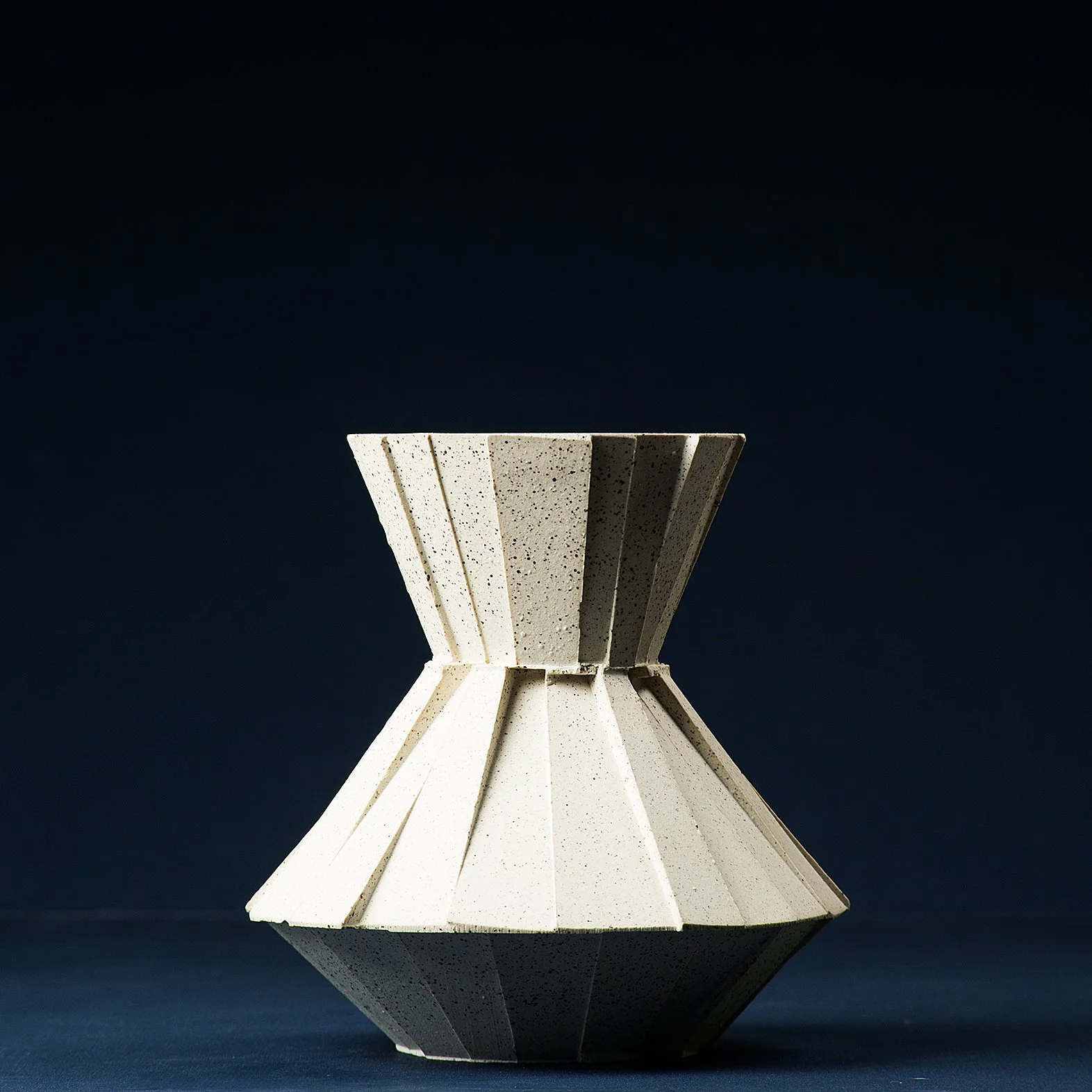 Handmade brutalist faceted ceramic carafe in speckled stoneware, by Lea & Nicolas