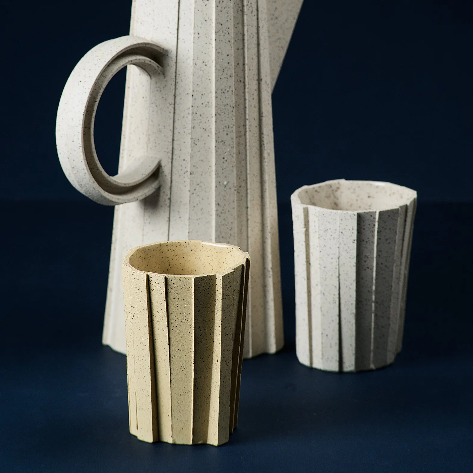 Handmade brutalist faceted ceramic tumbler, speckled yellow stoneware, by Lea & Nicolas