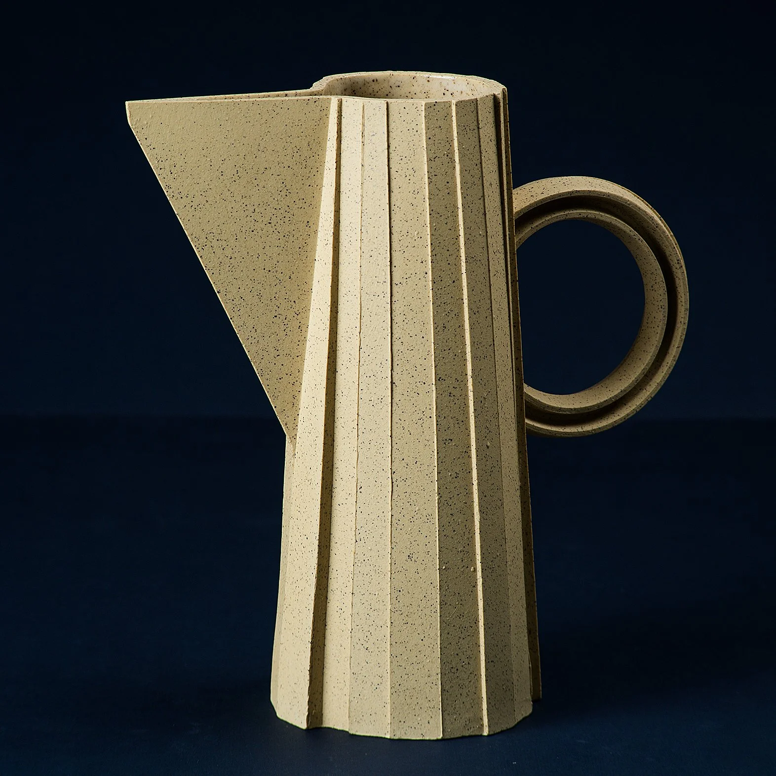 Handmade brutalist faceted ceramic pitcher in speckled yellow stoneware, by Lea & Nicolas