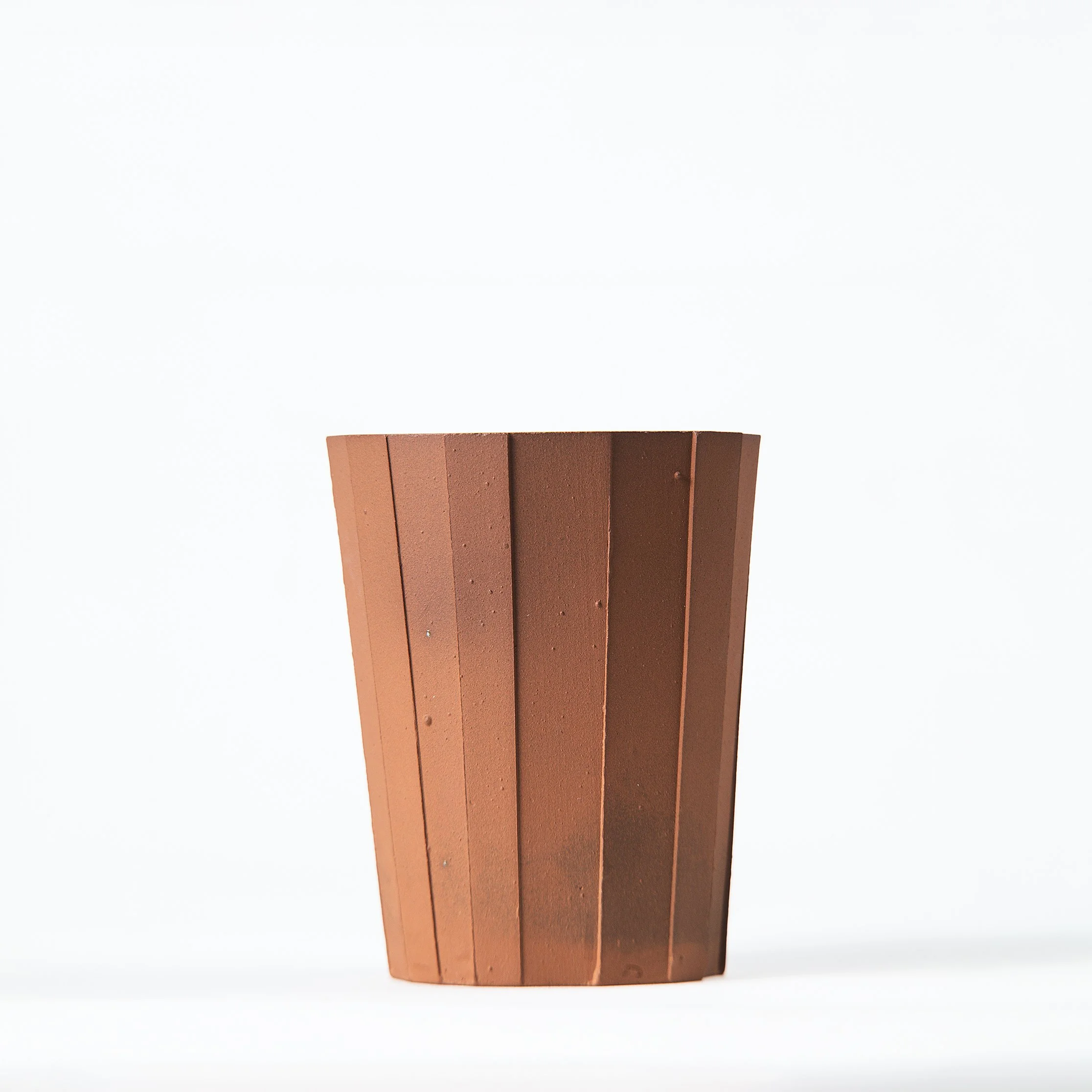 Handmade brutalist faceted ceramic tumbler, unglazed red stoneware, by Lea & Nicolas