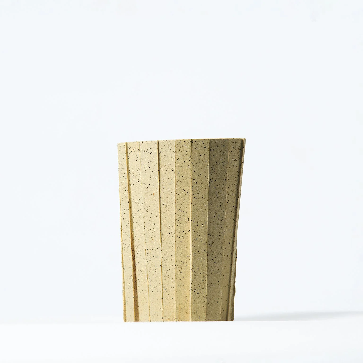 Handmade brutalist faceted ceramic tumbler, speckled yellow stoneware, by Lea & Nicolas