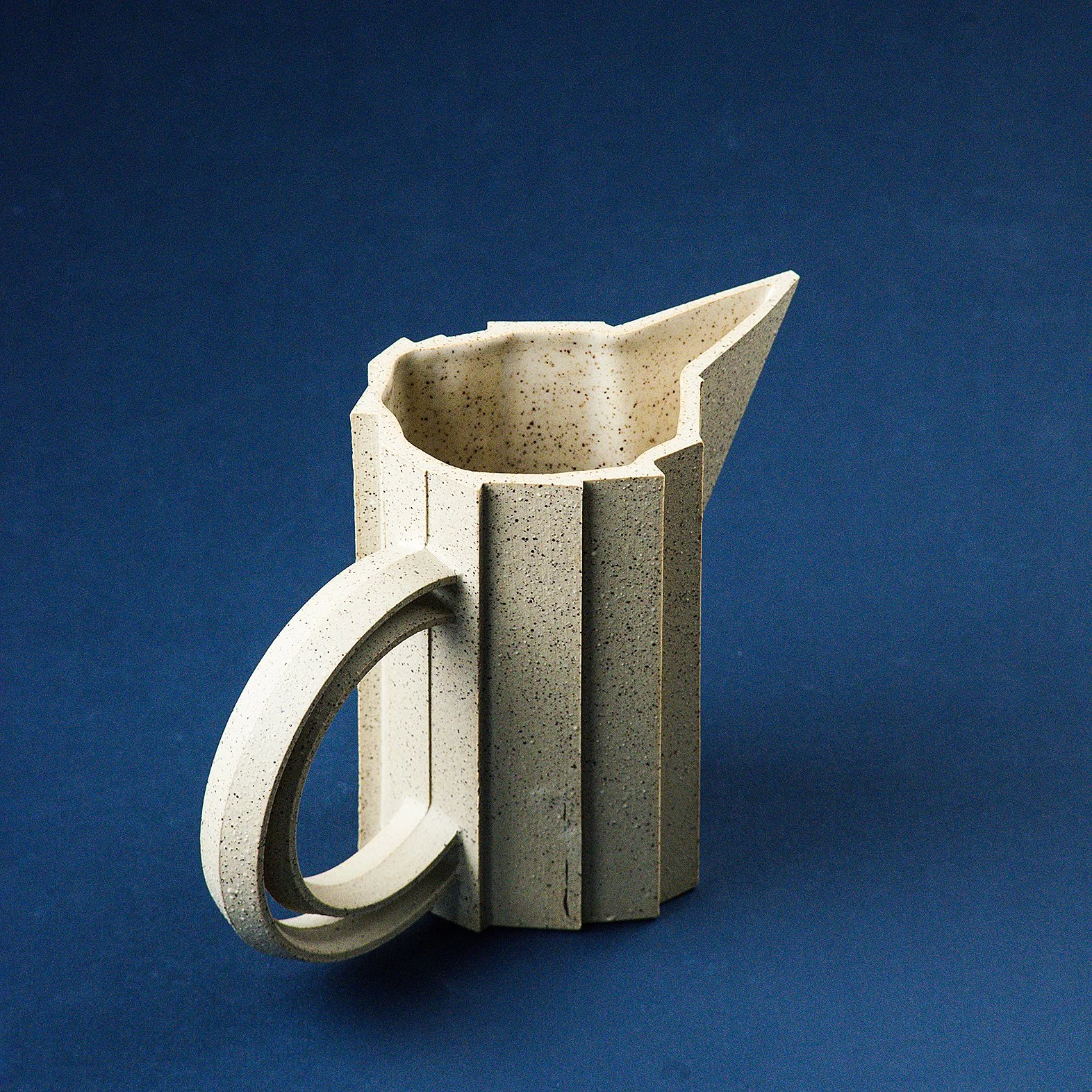 Handmade brutalist faceted ceramic pitcher in speckled stoneware, by Lea & Nicolas