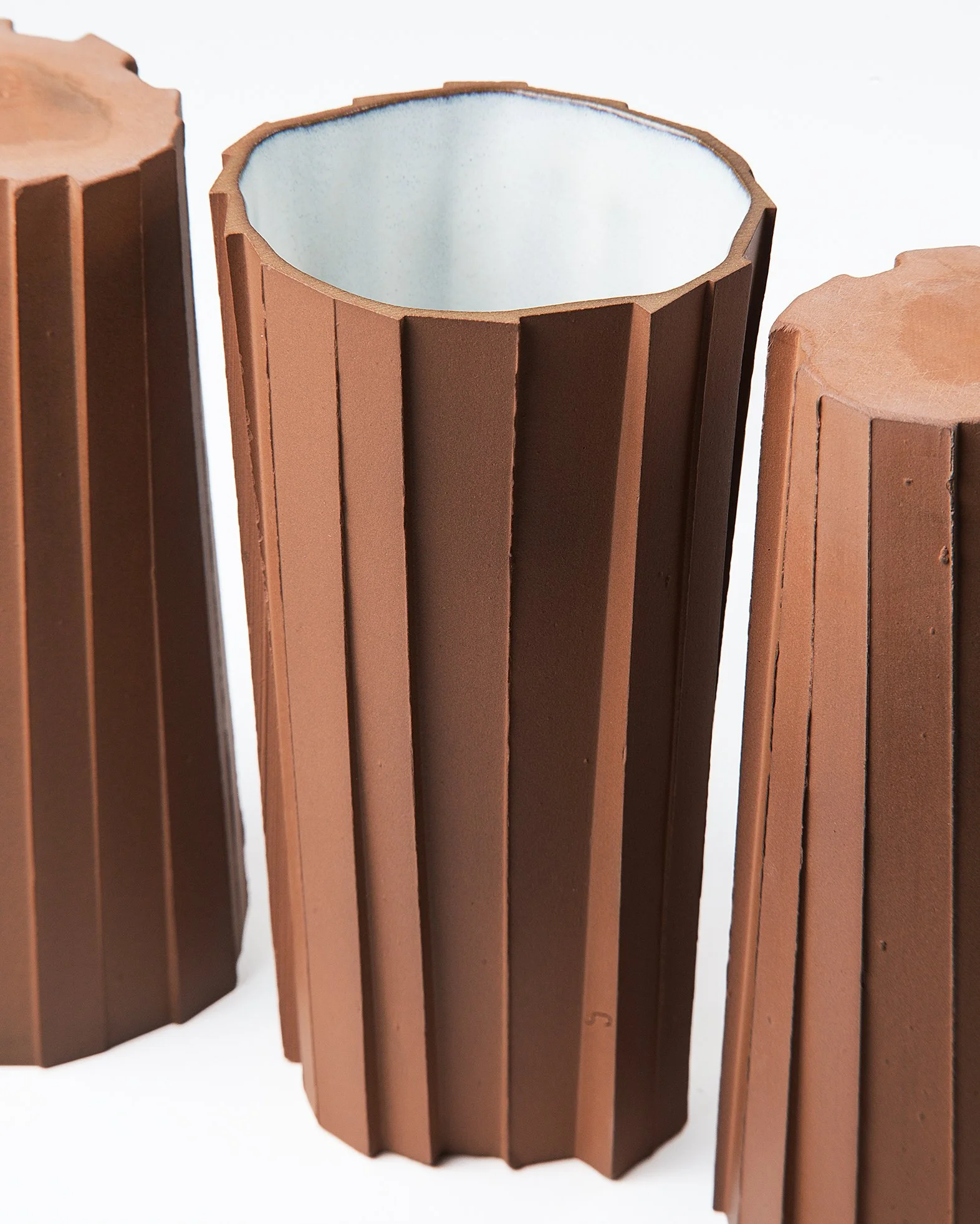 Handmade brutalist faceted ceramic tumbler, unglazed red stoneware, by Lea & Nicolas