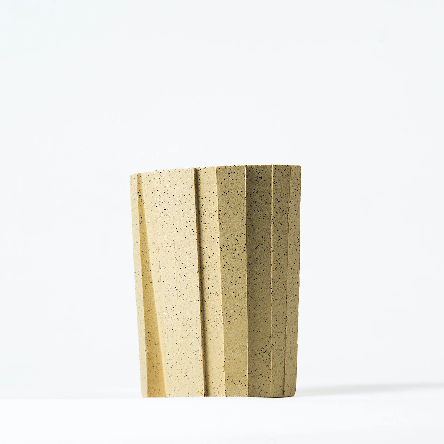 Handmade brutalist faceted ceramic tumbler, speckled yellow stoneware, by Lea & Nicolas