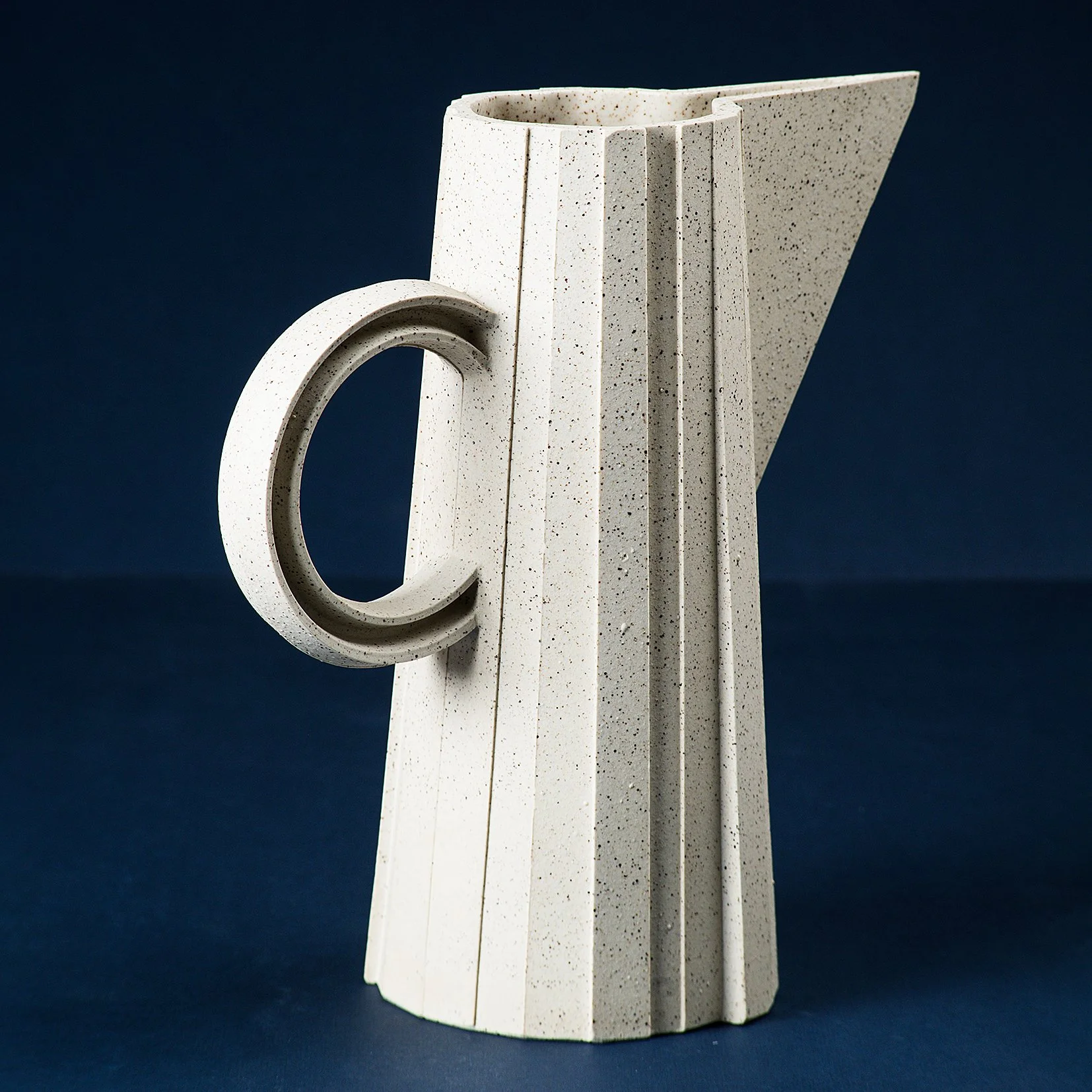 Handmade faceted ceramic pitcher in speckled white stoneware, by Lea & Nicolas