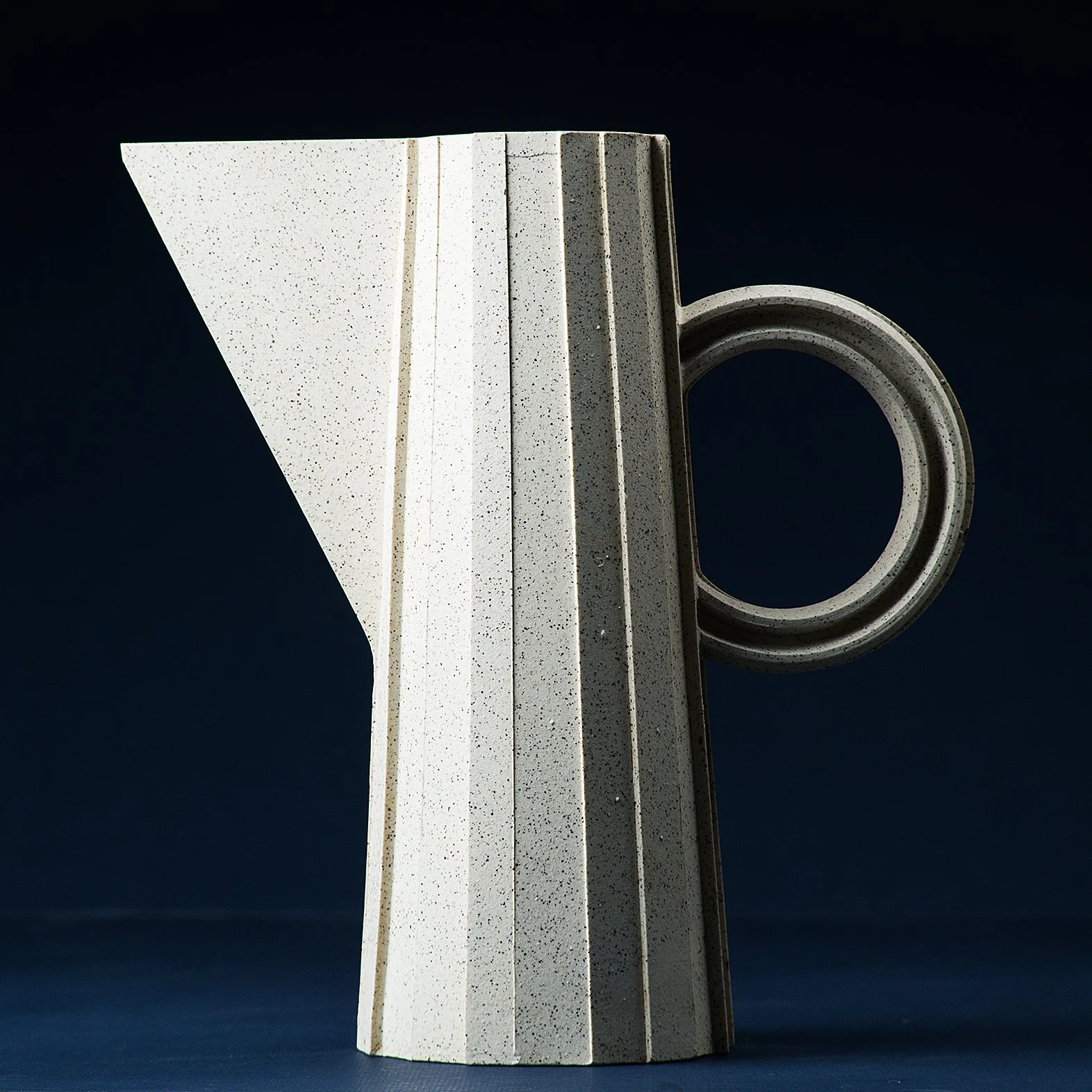 Handmade brutalist faceted ceramic pitcher in speckled stoneware, by Lea & Nicolas
